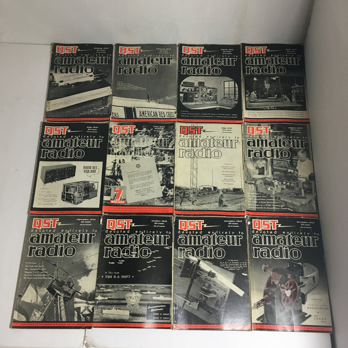 Lot of 12 Complete January to December 1945 QST Amateur Radio magazines showcasing various covers and themes from that year.