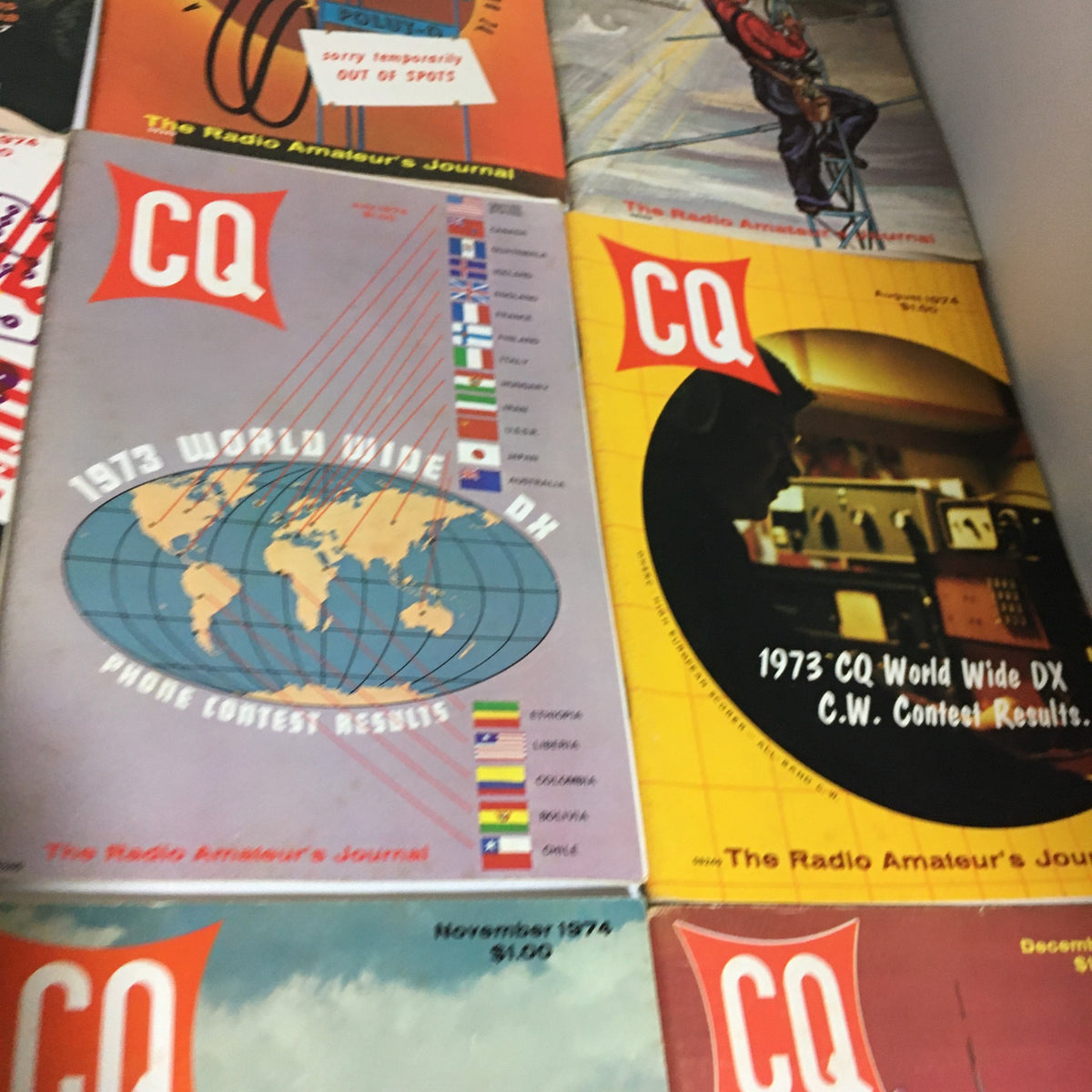Lot of 12 Complete January to December 1974 CQ The Radio Amateur's Journal depicting November and December 1974 covers, featuring global amateur radio contests and technological advancements.