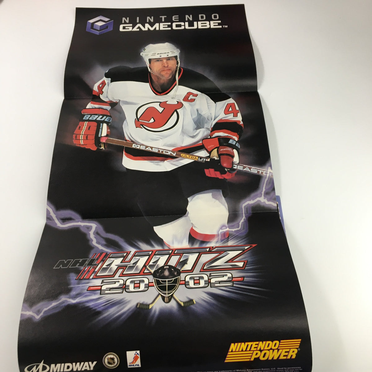 Fold-out poster from Nintendo Power Magazine Vol 148 September 2001 showcasing NHL Hitz 20-02, complete with featuring player's image.