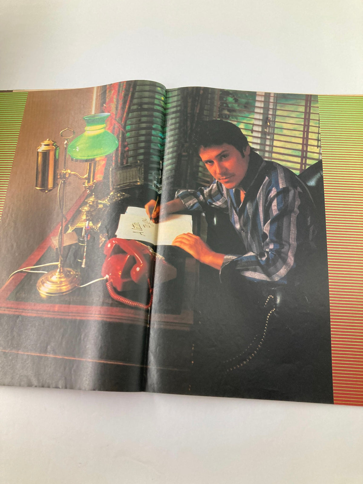 Inside spread of VTG Lookin Magazine September 15, 1984 showing Shakin' Stevens at a desk, capturing the essence of the era's pop culture.