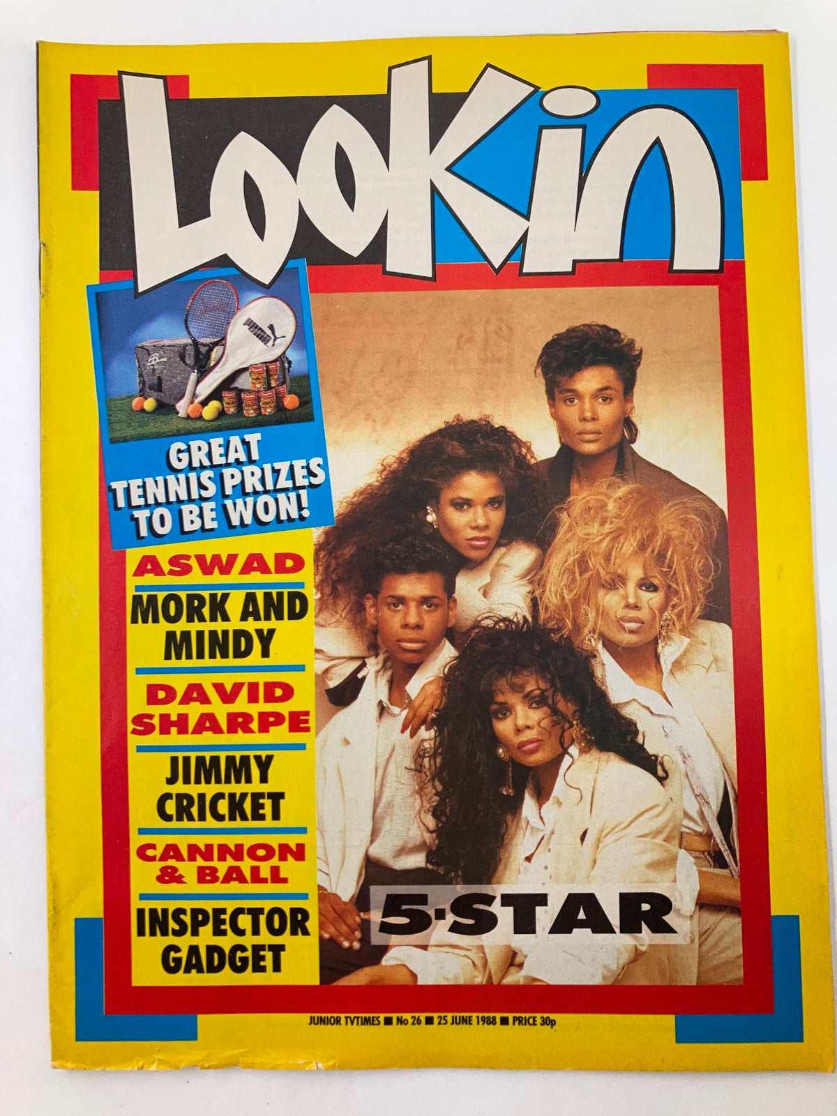 Cover of Lookin Magazine 1988 Issue #26 featuring pop culture icons. The cover includes vibrant colors and features individuals prominently, showcasing their stylish attire. Great for vintage magazine collectors.