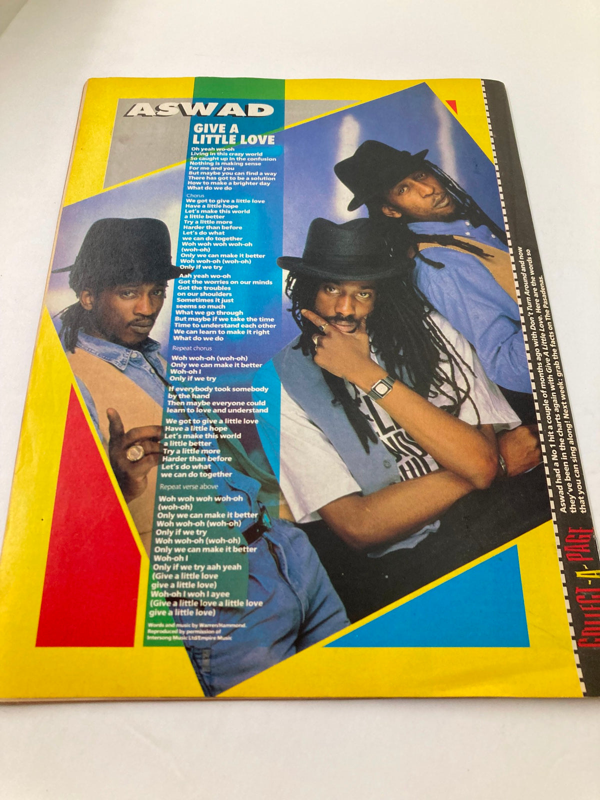 Cover of Lookin Magazine 1988 #26 featuring Aswad with the title 'Give a Little Love'. The magazine displays vibrant colors and features images of the band members in hats, showcasing the entertainment culture of the late 1980s.