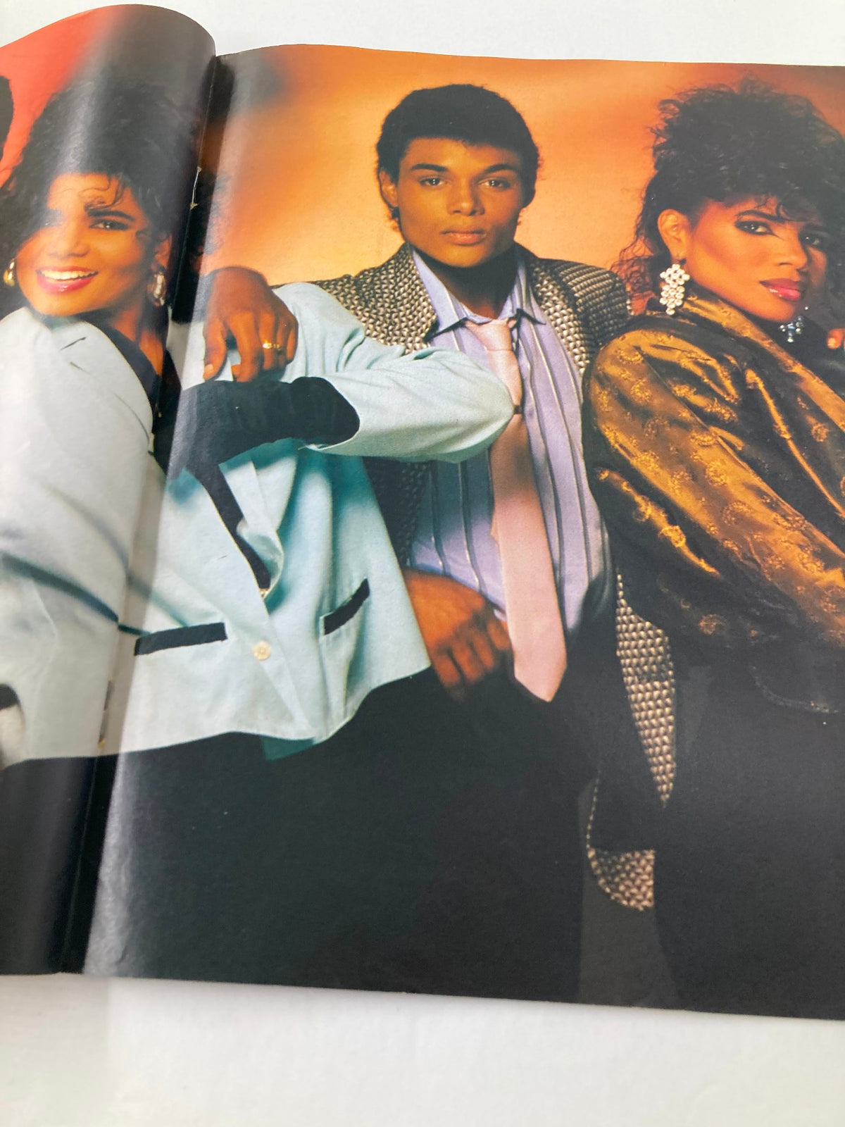 Inside spread of VTG Lookin Magazine August 9 1986 #33 showing another perspective of four artists in trendy 1980s attire, capturing the essence of the era.