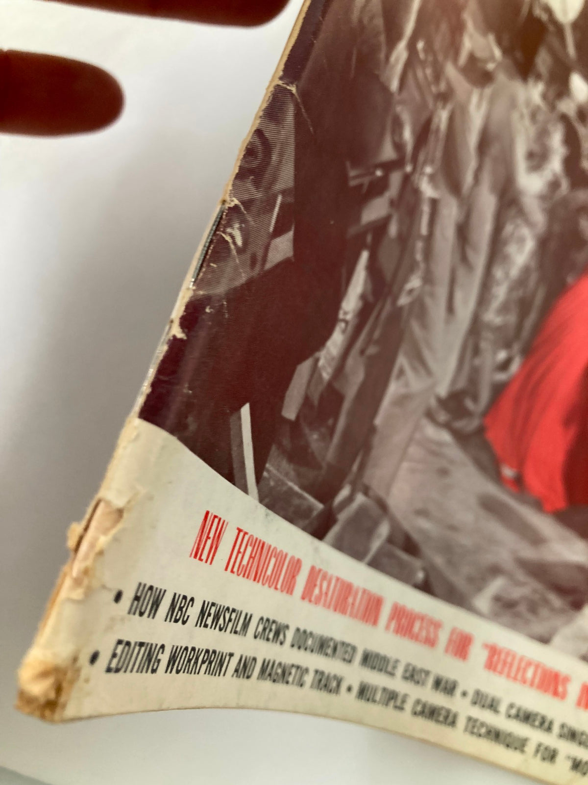 Close-up view of the edge of the American Cinematographer Magazine December 1967, highlighting the wear and vintage character of the publication.
