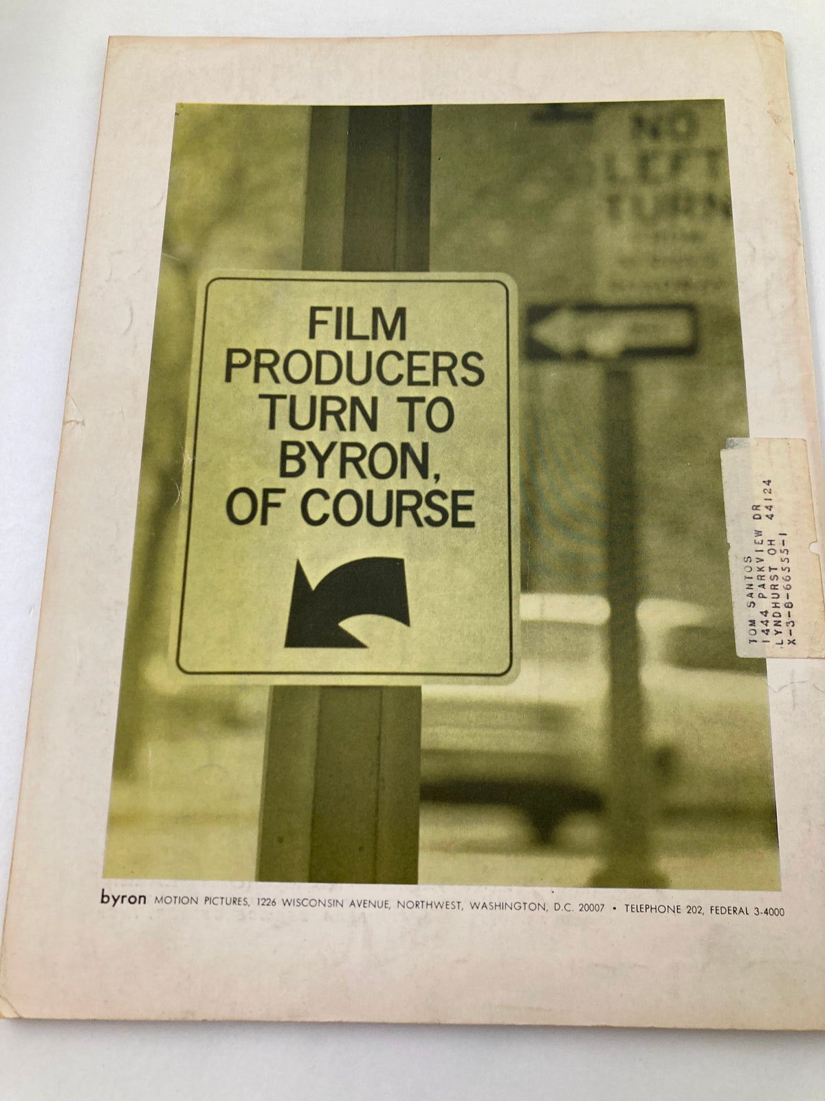 Back cover of American Cinematographer Magazine January 1968 displaying a sign reading 'Film Producers Turn to Byron, Of Course' against a muted background.