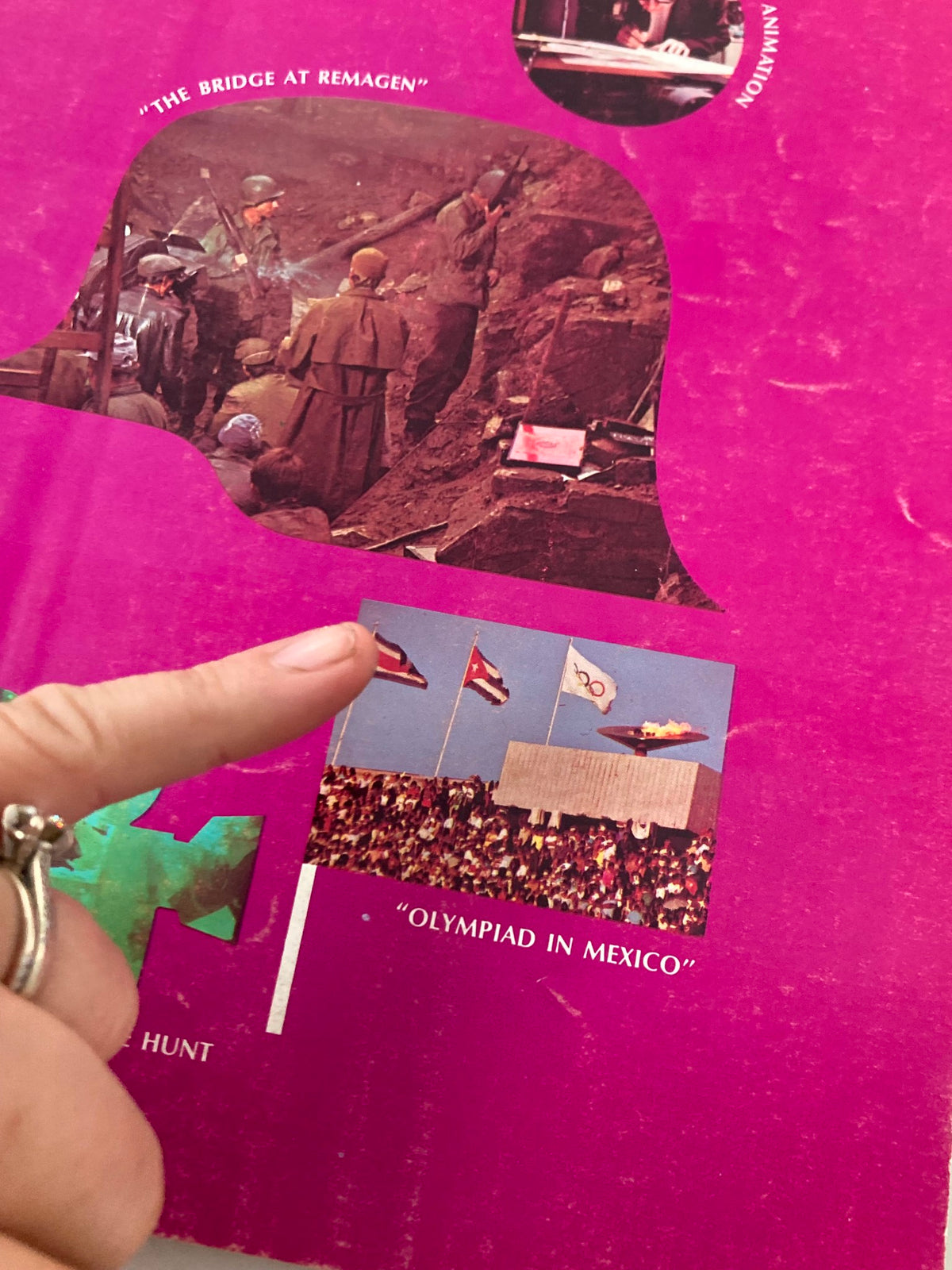 Close-up of the cover of American Cinematographer Magazine September 1969, highlighting the section about 'Olympiad in Mexico' with a finger pointing at it.