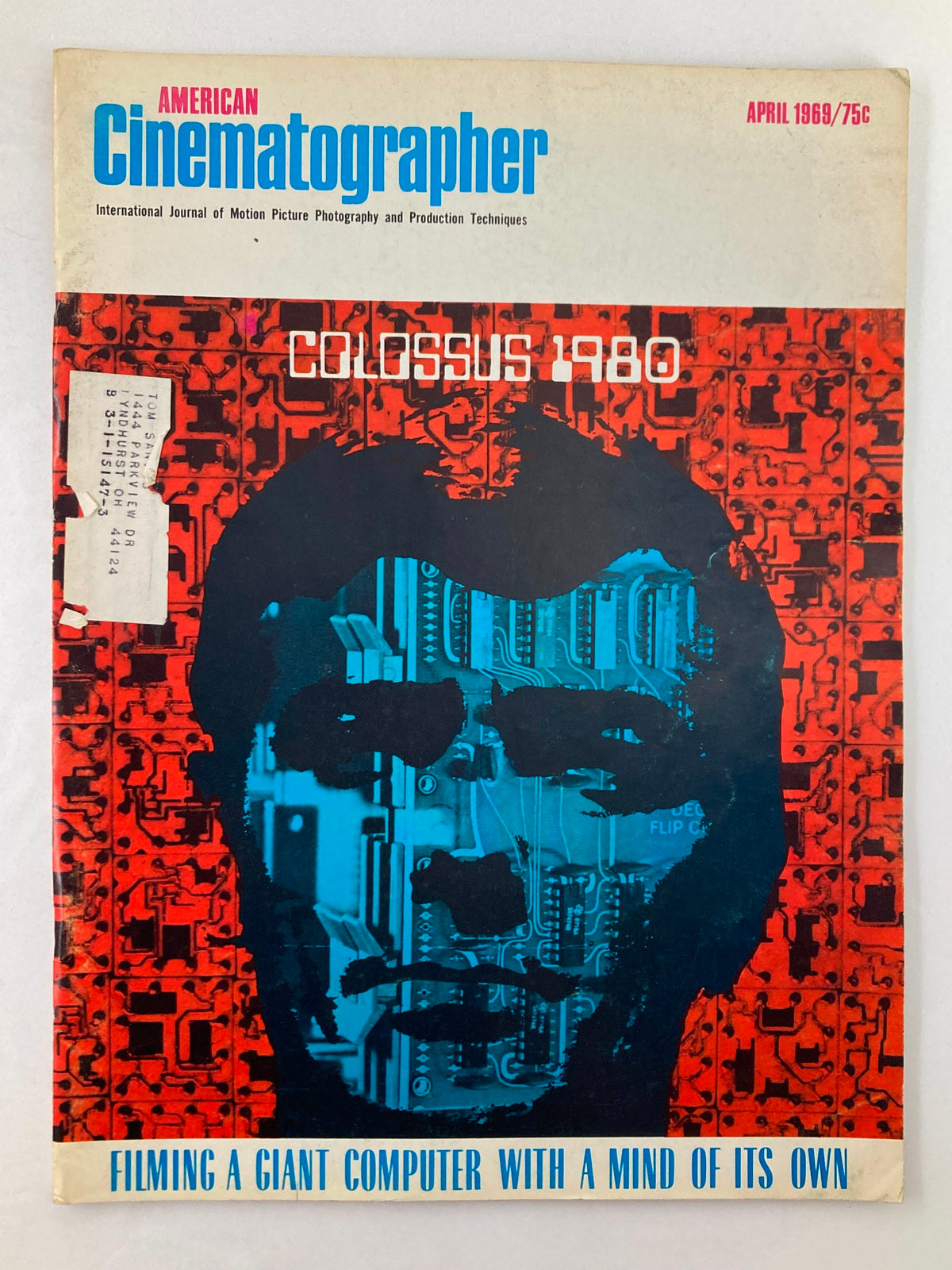 Cover of American Cinematographer Magazine, April 1969 edition featuring 'Colossus 1980' and the tagline 'Filming a giant computer with a mind of its own'. The striking graphic design incorporates colors and imagery related to technology and cinematography.