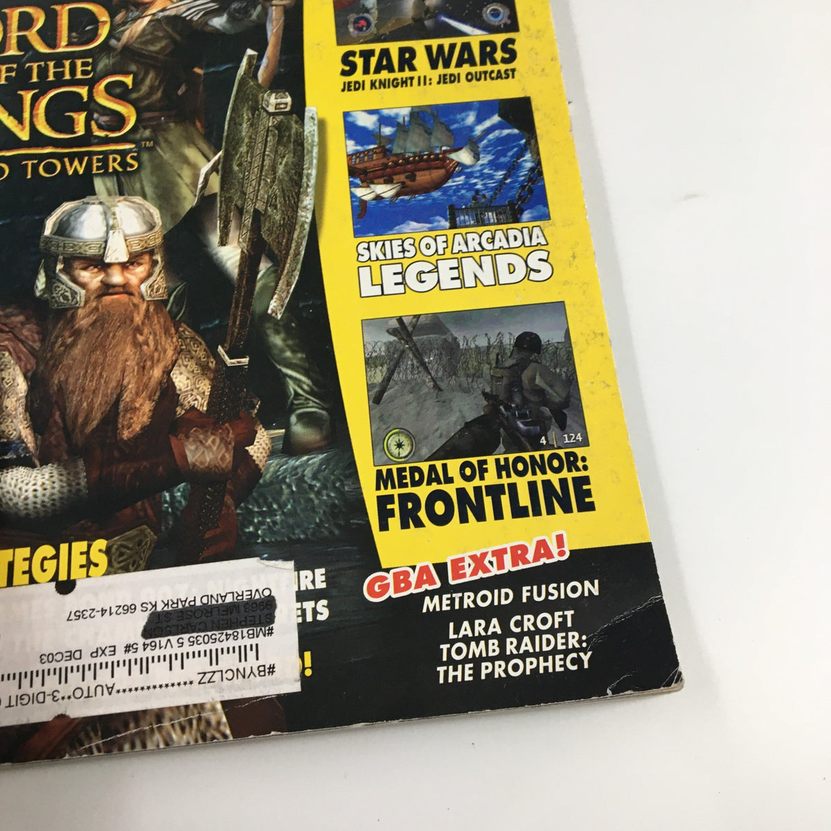 Close-up of the side panel of Nintendo Power Magazine Vol. 164 January 2003, showcasing features on Star Wars Jedi Knight and Medal of Honor Frontline.