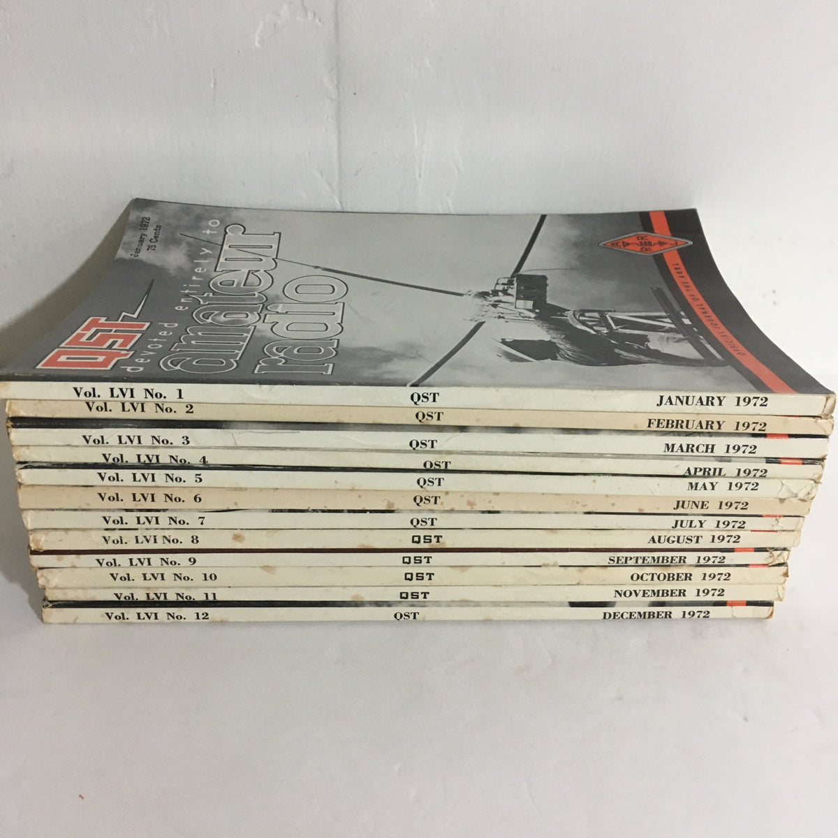 Lot of 12 Complete January to December 1972 QST Amateur Radio - Display of magazine volumes stacked, highlighting the vintage titles from 1972 related to amateur radio.