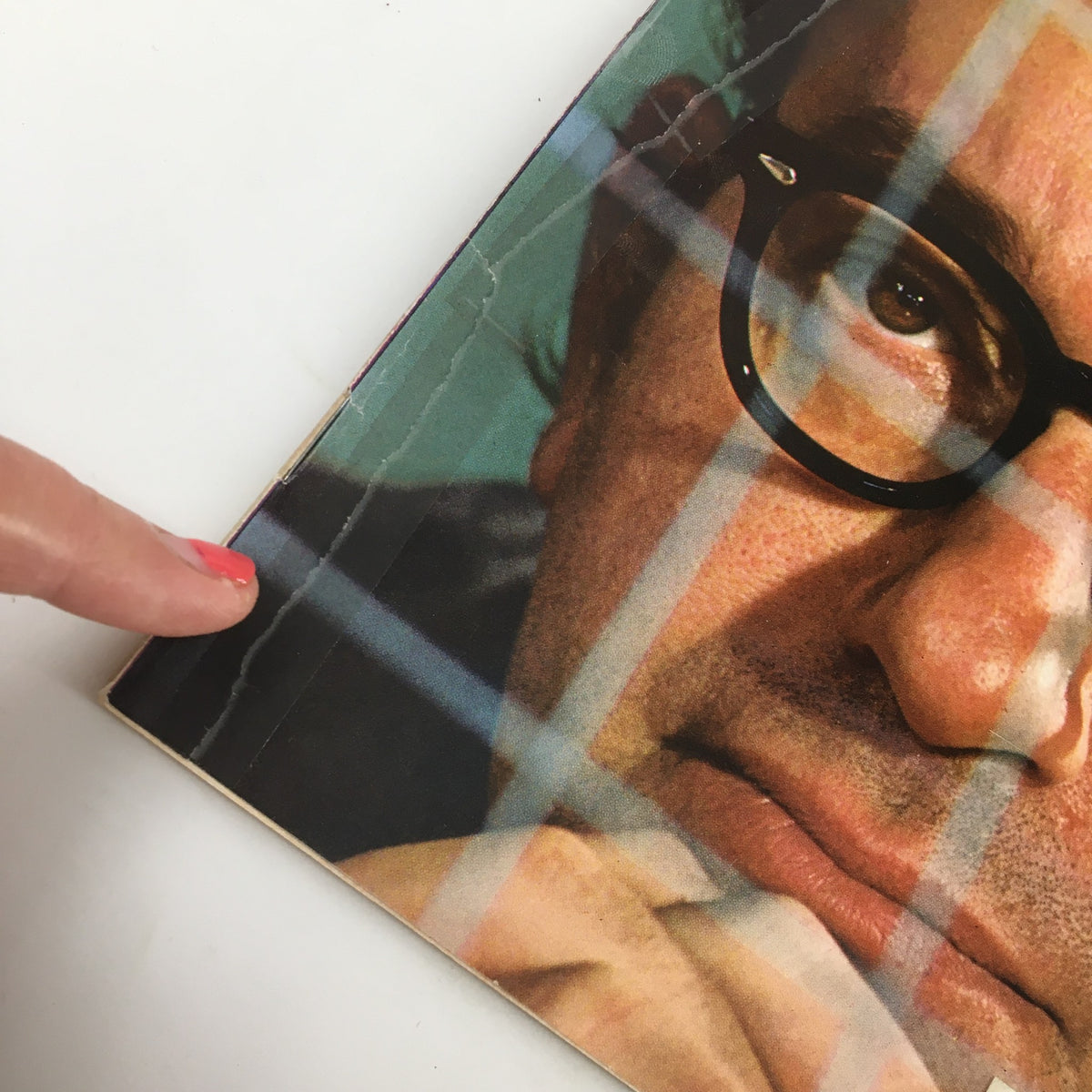 Detailed view of the Newsweek Magazine February 24, 1975 cover showing a cracked edge and a finger pointing at the image of Alan Greenspan, reflecting on economic themes.