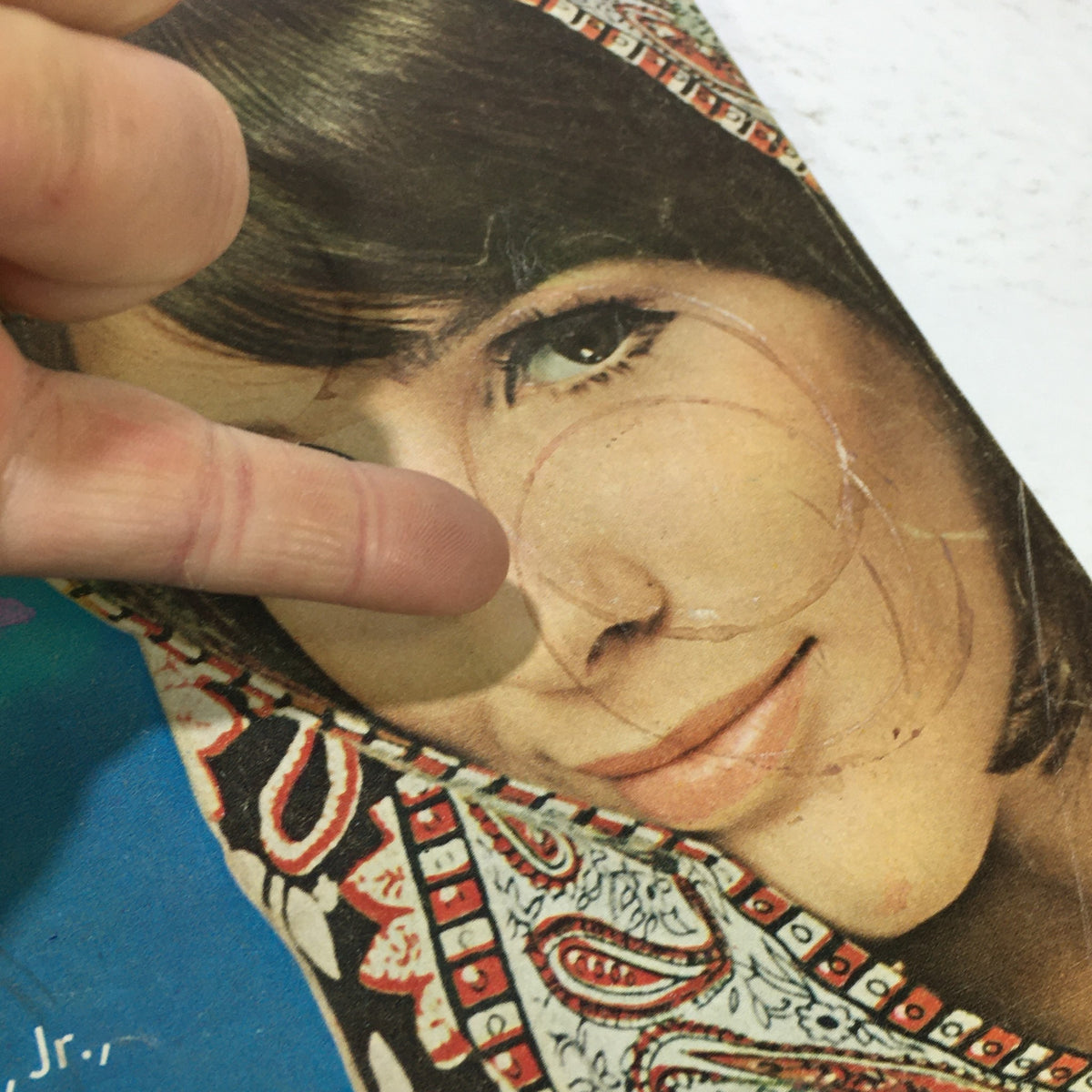 Close-up of the VTG Mademoiselle Magazine April 1965 cover, highlighting the model's face and intricate shawl design, showcasing vintage fashion details.
