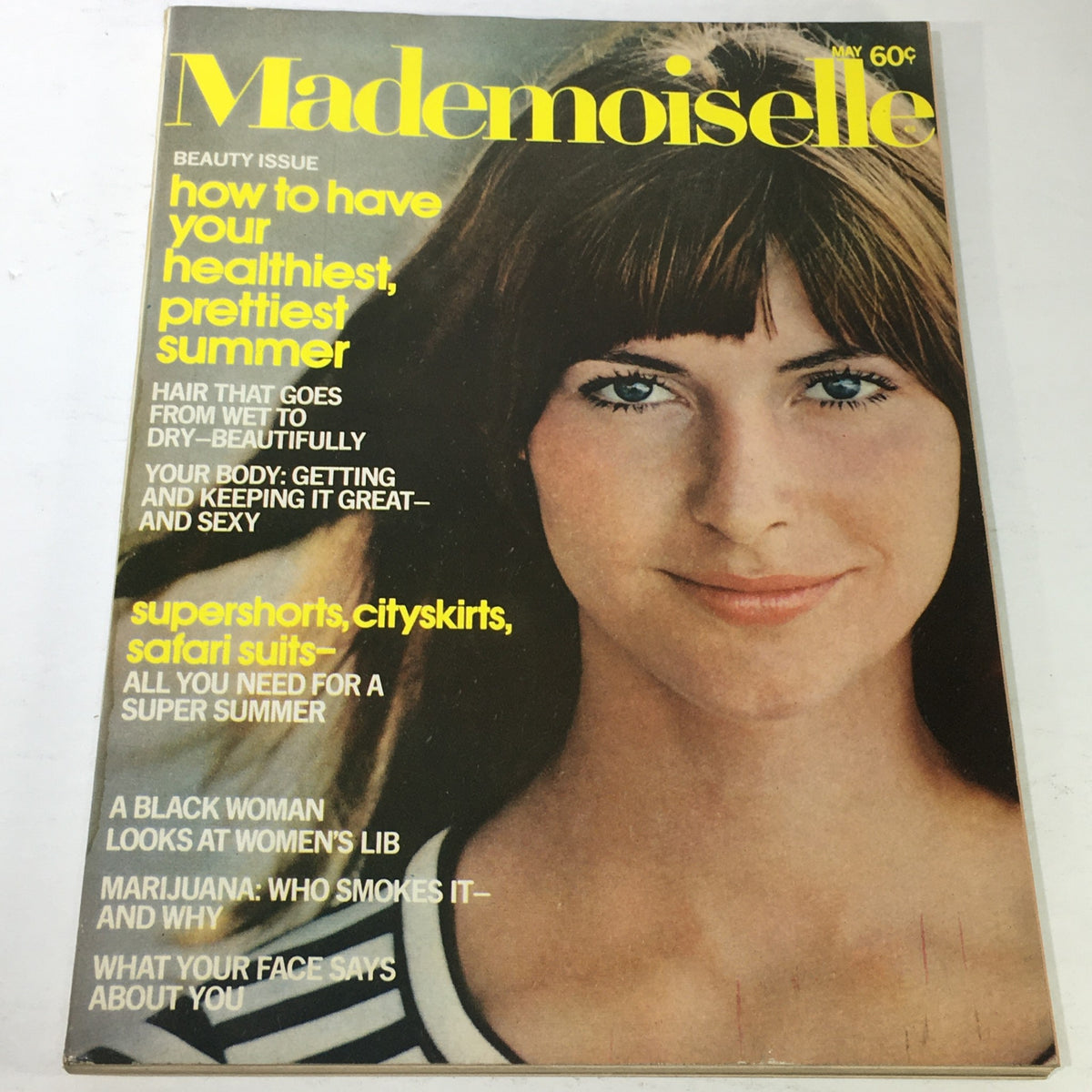 Cover of VTG Mademoiselle Magazine: May 1971 - Beauty Issue featuring a beautiful model, highlighting articles on health, fashion, and feminist issues.