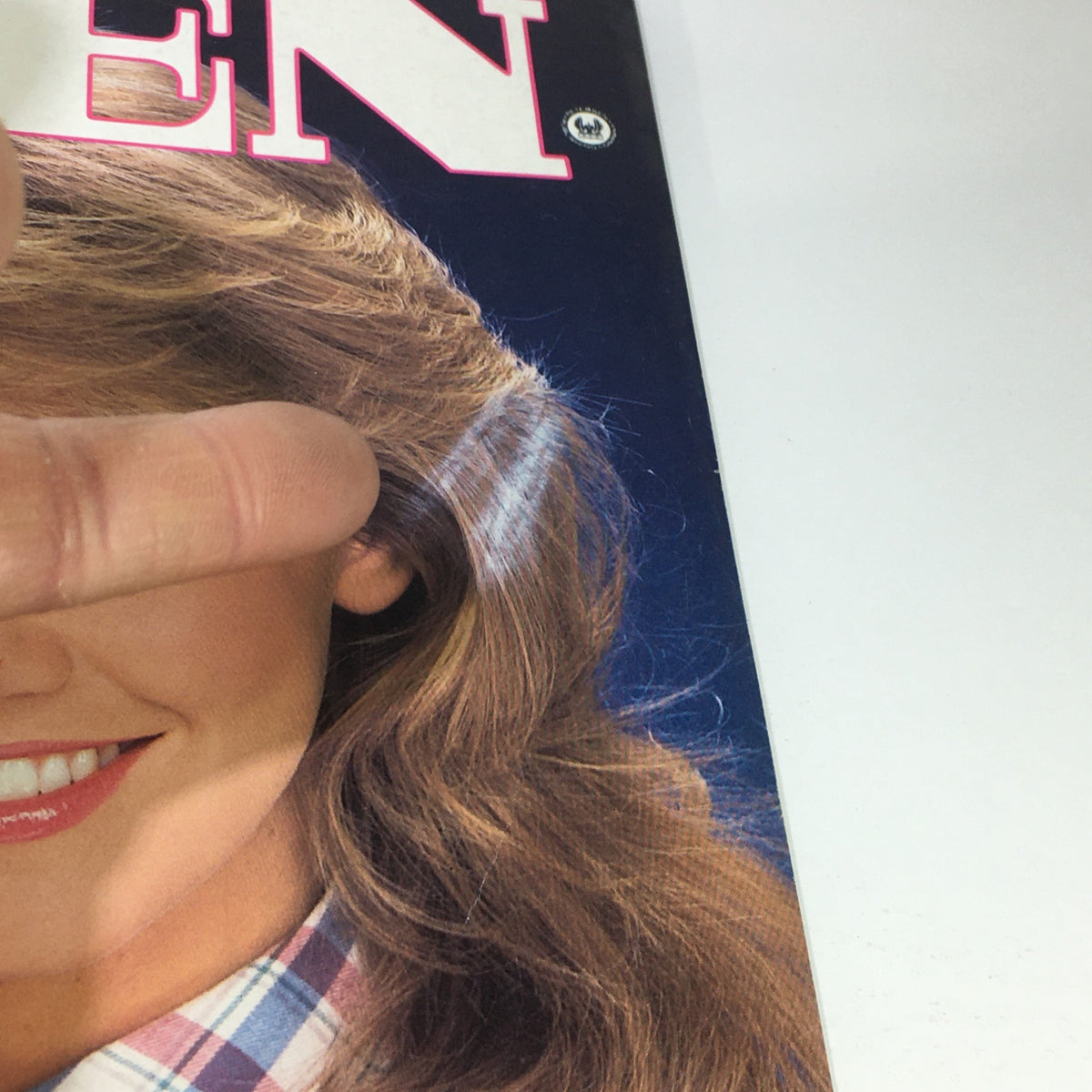 Close-up view of the VTG Teen Magazine: September 1983 cover featuring a blonde model with stylish hair and a patterned dress, showcasing articles related to teen culture.