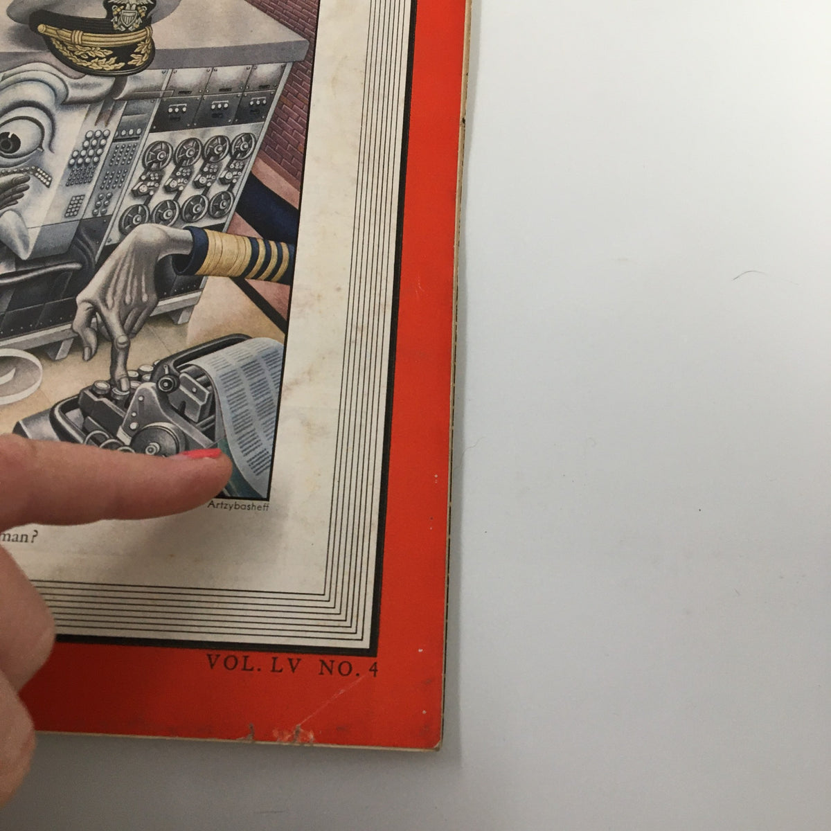 Close-up of the cover of VTG Time Magazine January 23 1950 Vol. 55 No. 4 highlighting the illustration related to the article 'Can Man Build Superman?' with a hand pointing at the artwork.