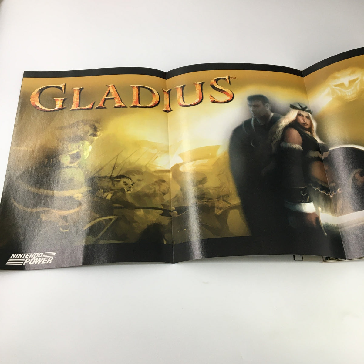 Full-page spread in Nintendo Power Magazine Vol 171 September 2003 showcasing Gladius, with artwork depicting characters and scenes from the game.