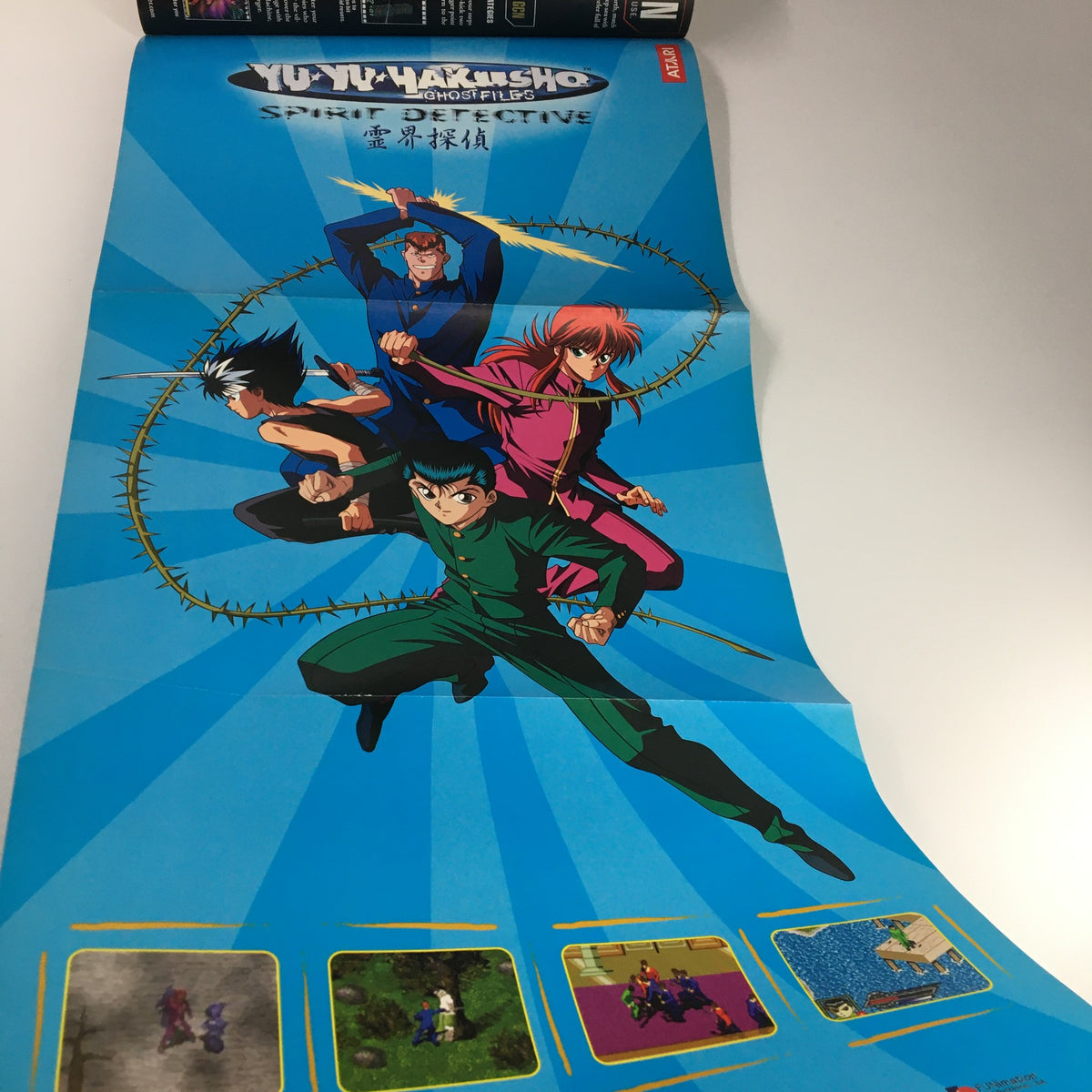 Yu Yu Hakusho Spirit Detective poster featured in Nintendo Power Magazine Vol 174 December 2003, showcasing iconic characters in an action scene with a vibrant blue background.