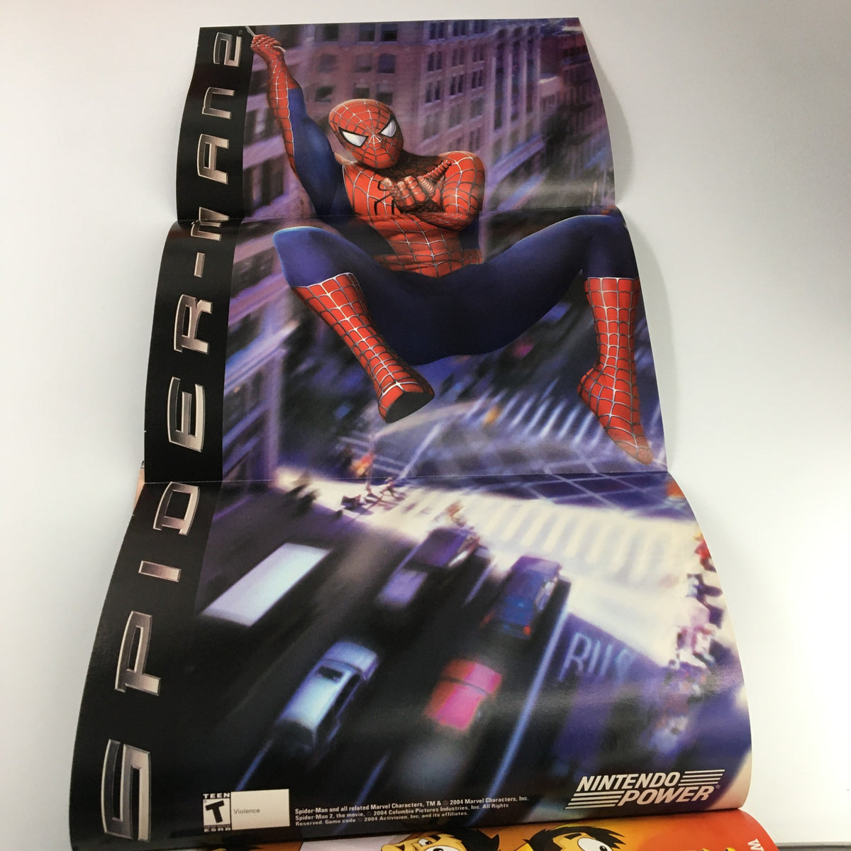 Inside poster from Nintendo Power Magazine #182, August 2004 featuring Spider-Man, showcasing collectible gaming memorabilia.