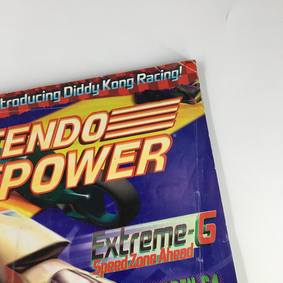 Top corner of Nintendo Power Magazine #101 from October 1997, showcasing the title and the 'Extreme-6 Speed Zone Ahead' feature. A great collectible for Nintendo fans.