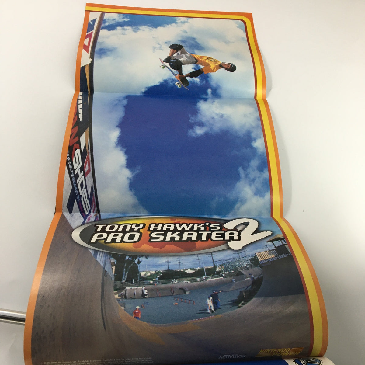Fold-out poster from Nintendo Power Magazine #145 June 2001, showcasing Tony Hawk's Pro Skater 2 with an action shot of a skater performing a trick in an outdoor skate park.