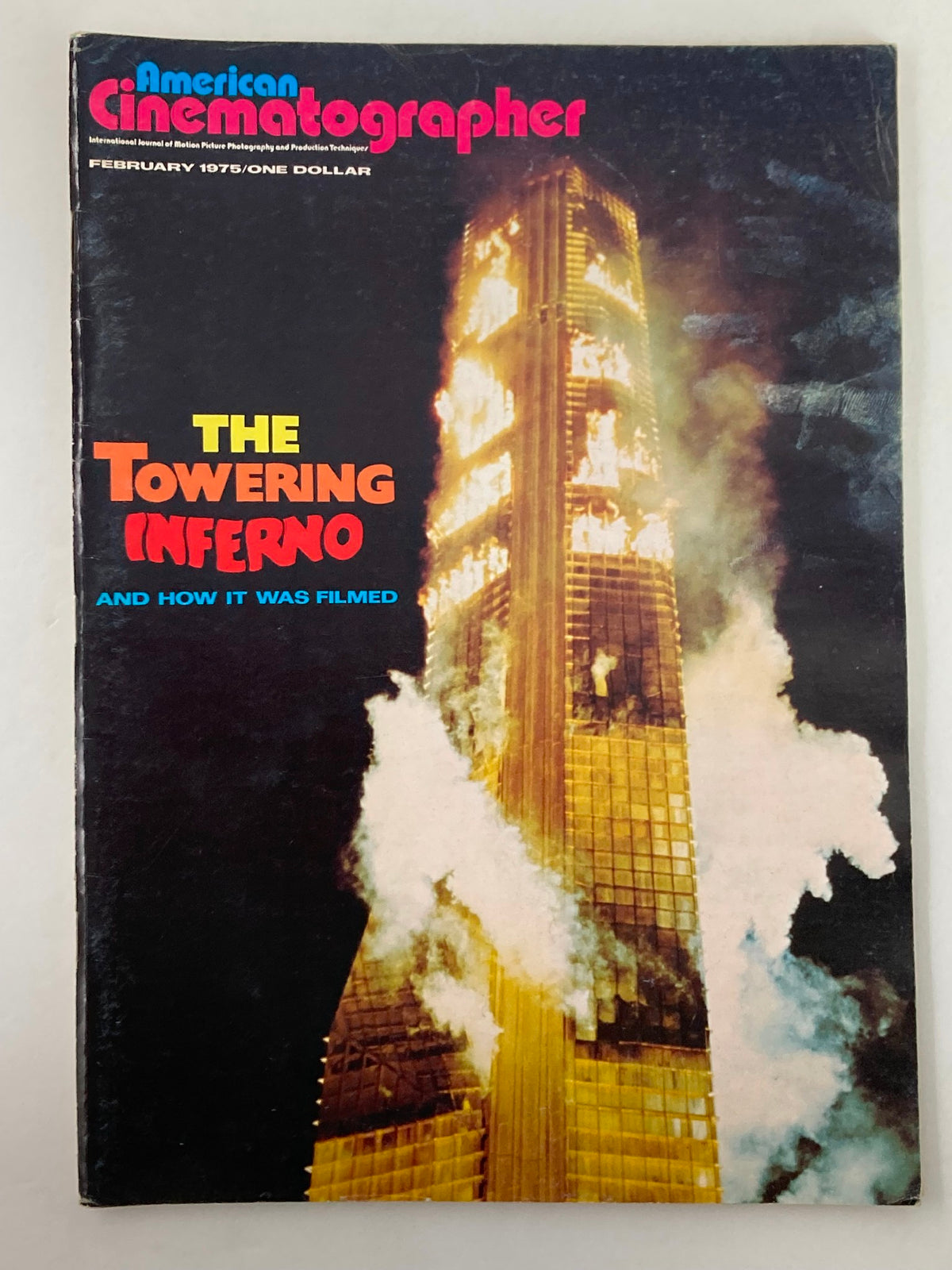 American Cinematographer Magazine February 1975 cover featuring Irwin Allen's The Towering Inferno, showcasing the burning building and cinematic elements.