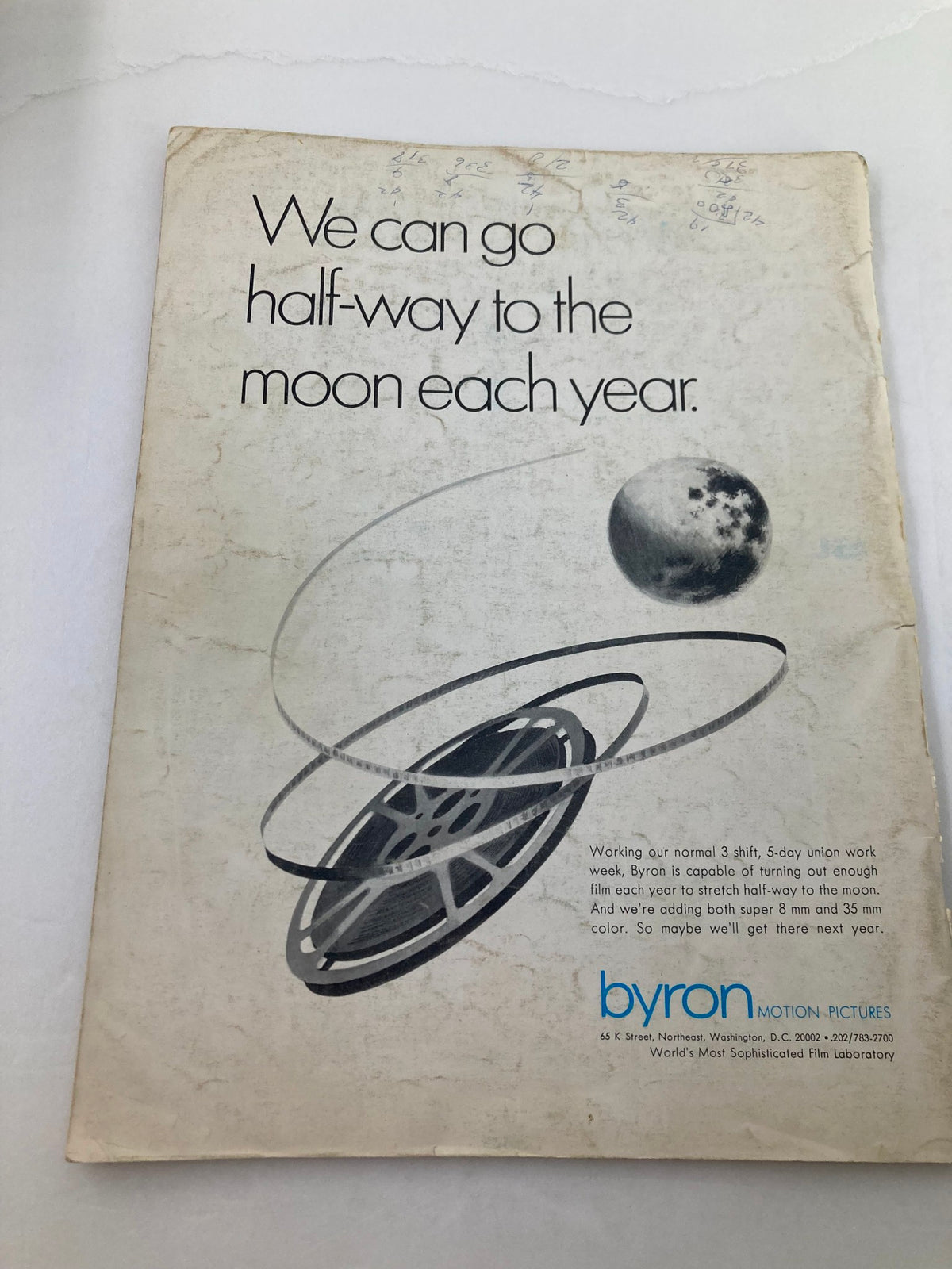 Back cover of American Cinematographer Magazine December 1969 featuring an advertisement from Byron Motion Pictures with a graphic of a film reel and the moon.