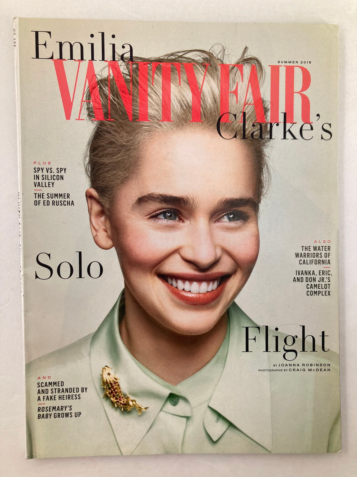 Summer 2018 Vanity Fair Magazine featuring Emilia Clarke on the cover, showcasing her captivating smile and a stunning design, highlighting the theme of flight in the issue.