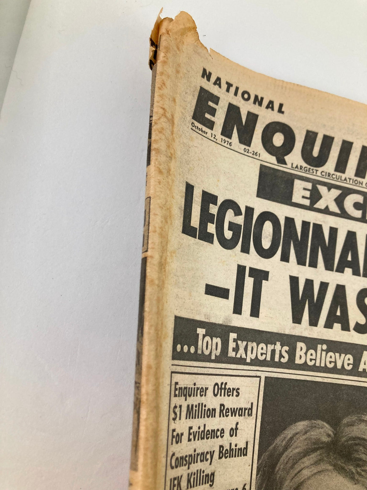 National Enquirer tabloid from October 12, 1976, displaying the newspaper's edge with wear and tear, highlighting its vintage condition.