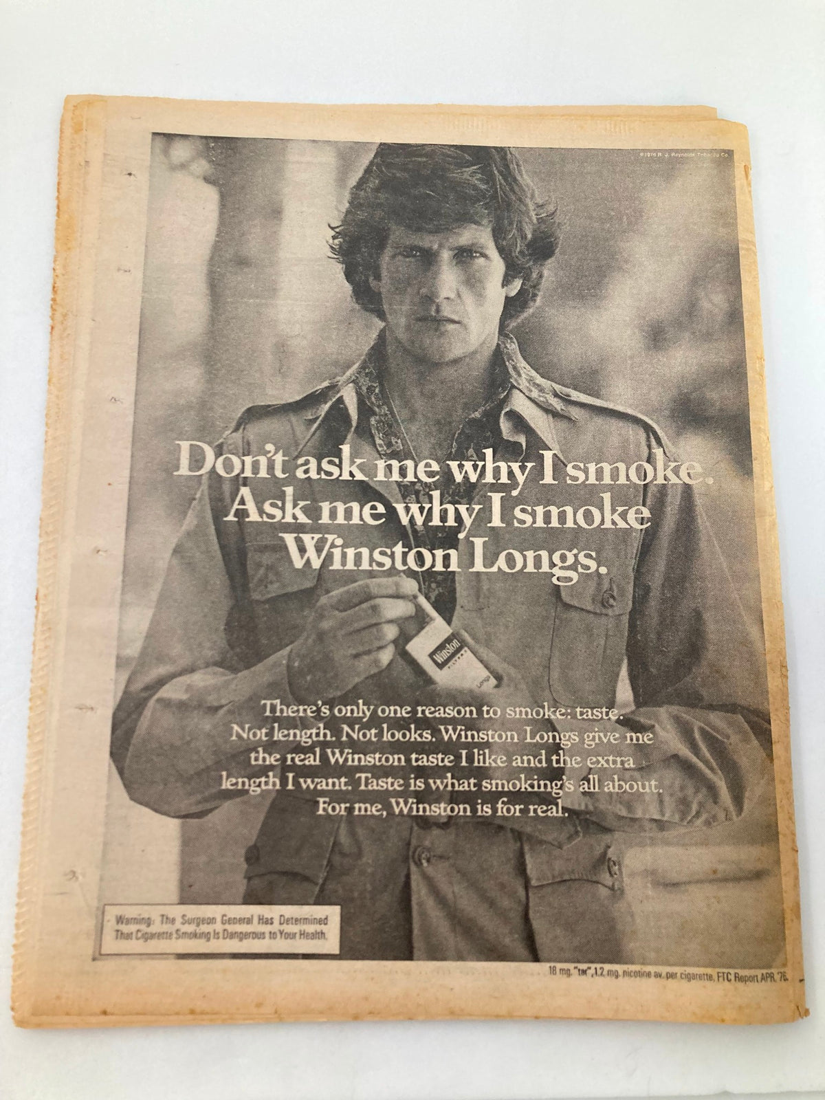 National Enquirer Tabloid ad from January 11 1977 promoting Winston Longs cigarettes with a man holding a pack.
