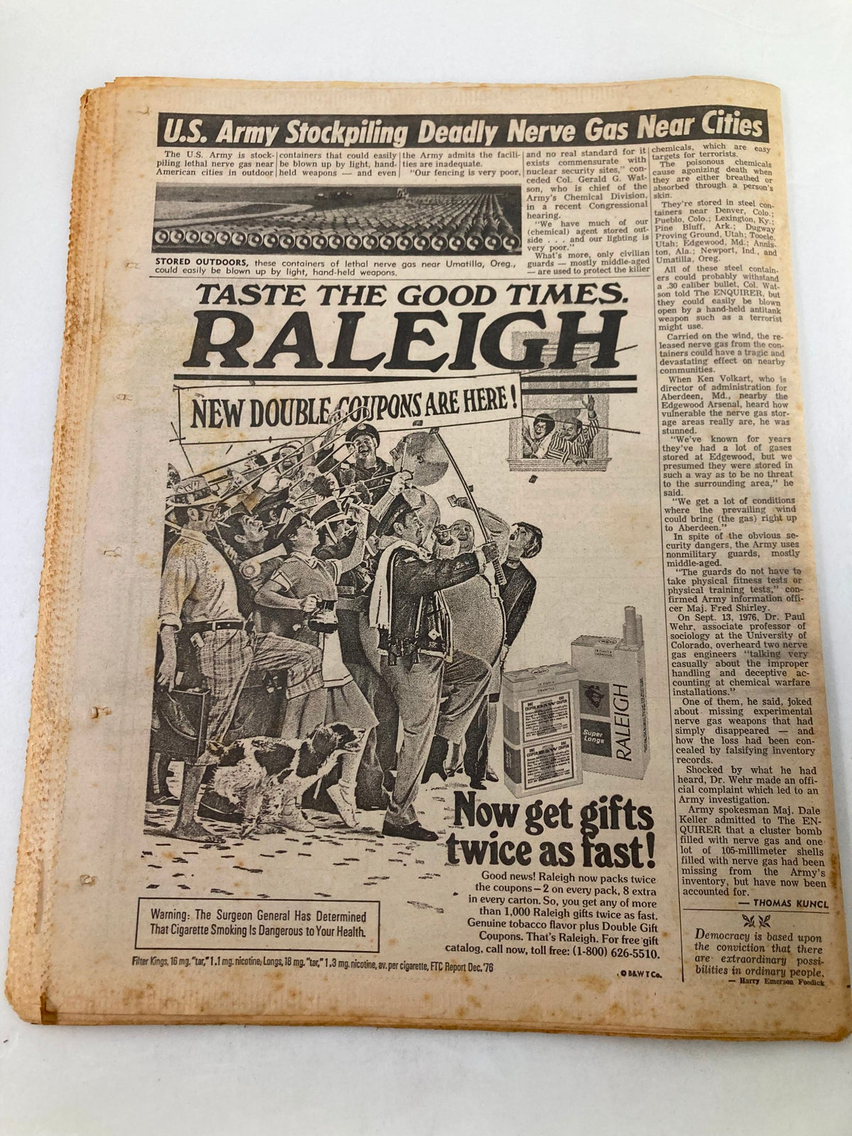 Back cover of National Enquirer Tabloid October 4 1977, highlighting promotions for Raleigh and featuring a crowd scene, with minor wear visible on the edges.
