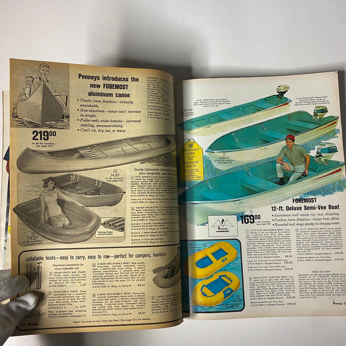 1966 JC Penneys Spring and Summer Store Catalog illustrating a selection of boats including aluminum canoes and deluxe semi-vee boats, along with pricing.