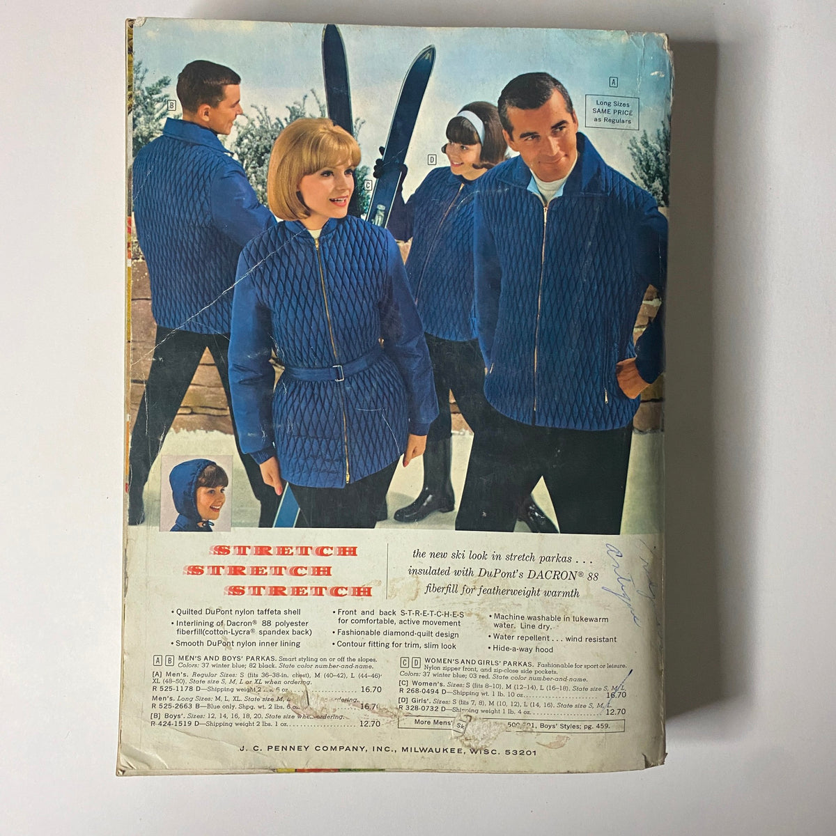 1964 JC Penneys Fall and Winter Store Catalog cover featuring models in stylish blue stretch parkas and winter attire, reflecting mid-century American fashion trends.
