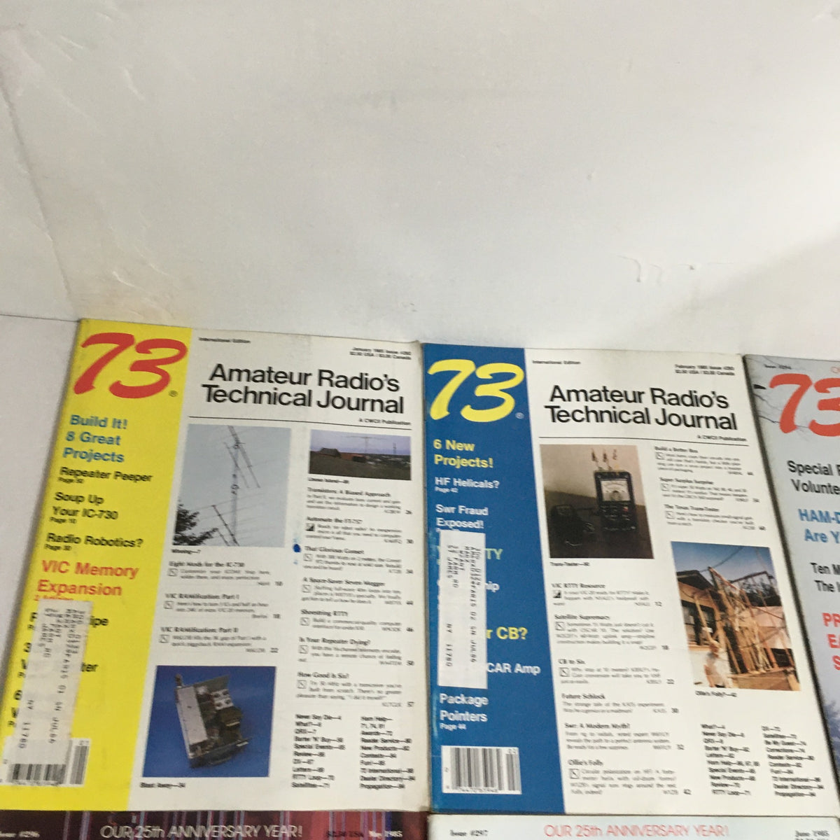 Close-up of magazine covers from 73 Amateur Radio's Technical Journal, featuring highlights from different editions, part of the complete collection for 1985.