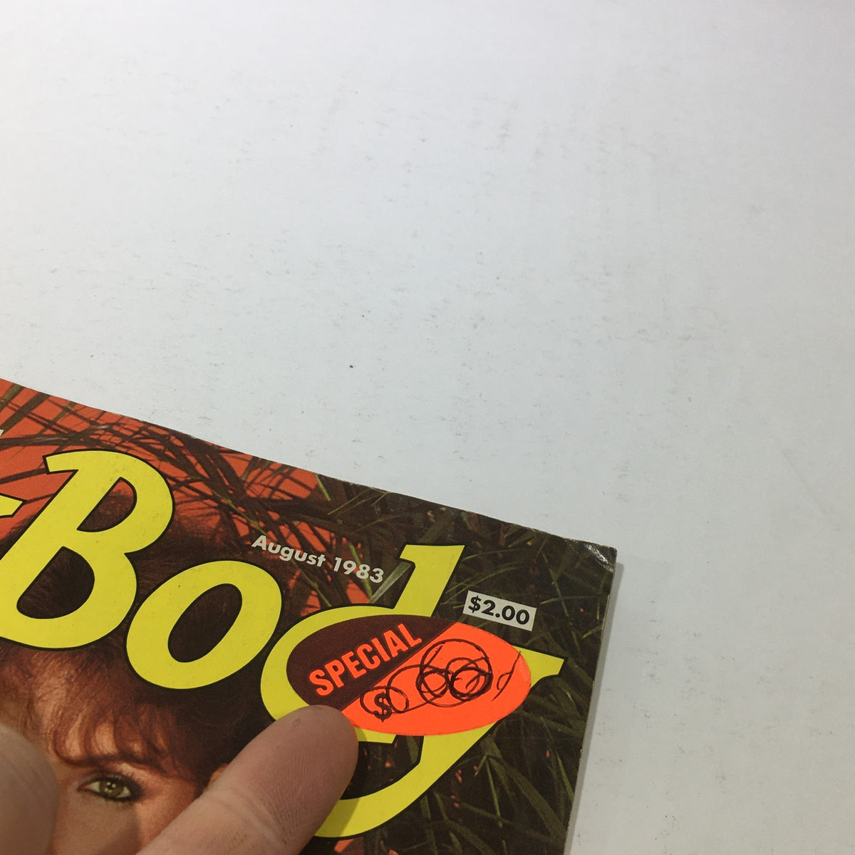 Detail of the cover of Pretty Body Magazine: August 1983 showing the 'Special' price sticker and vintage design elements.