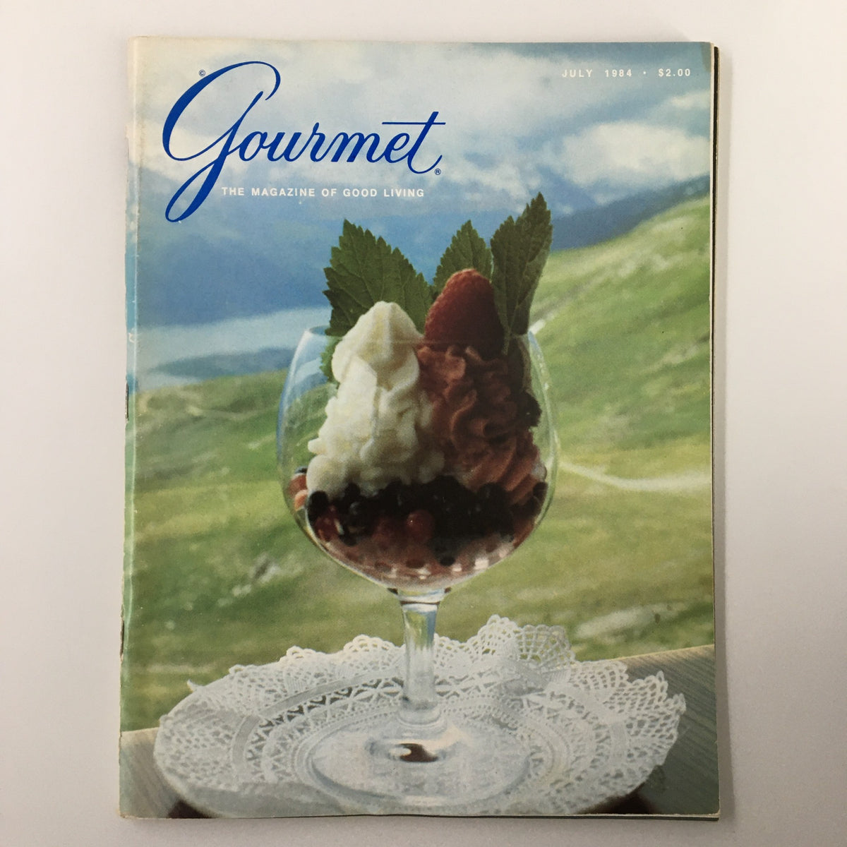 Gourmet Magazine July 1984 cover featuring an elegant dessert presentation with fresh fruit, showcasing culinary artistry of the 1980s.