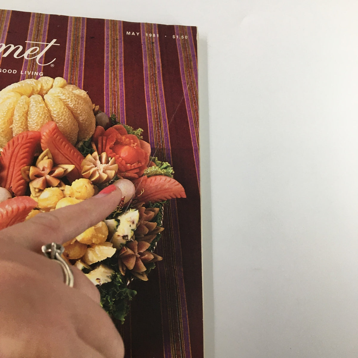 Close-up of the cover of VTG Gourmet Magazine May 1981, highlighting the details of the intricately carved basket of local fruits.