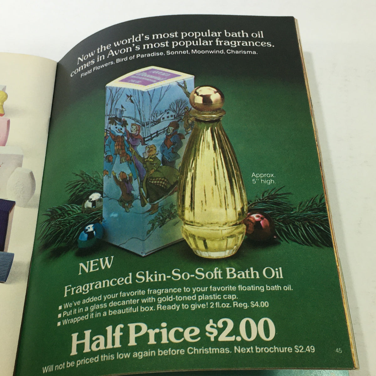 VTG Avon Catalog: 1974 - Fashion Accessory Brochure - An advertisement for Avon’s popular bath oil in a gold-toned decanter, presented as a holiday gift option in the 1974 catalog.