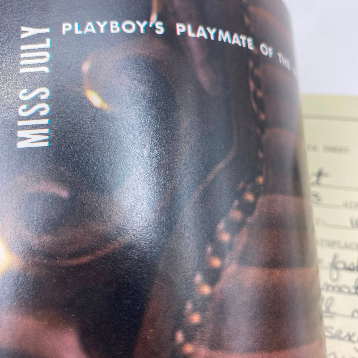 Close-up image of the July 1984 Playboy Magazine featuring Playmate of the Month, Liz Stewart, showcasing the vintage design and iconic branding.