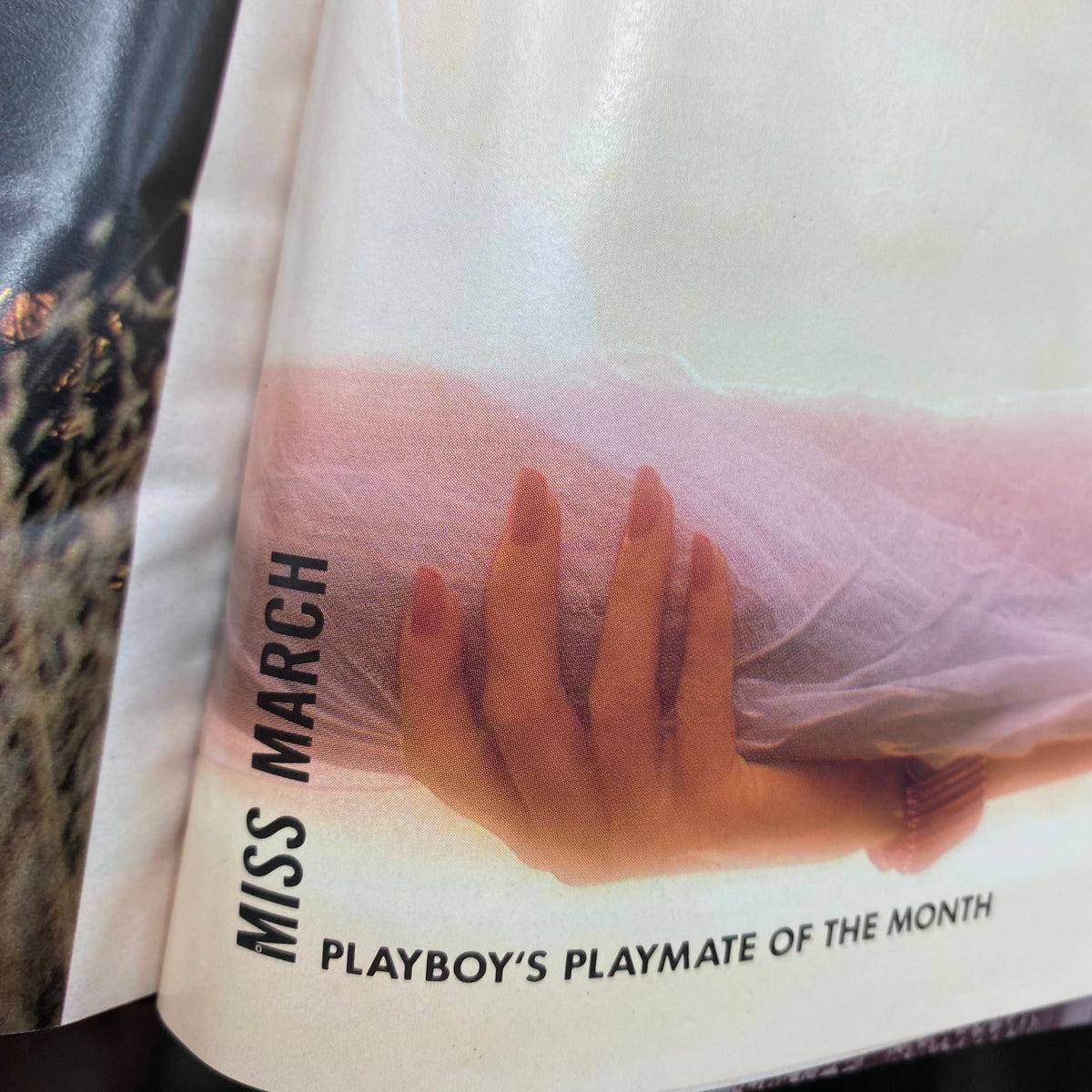 Playboy Magazine March 1988 showcasing the text 'Miss March', highlighting the Playmate of the Month with a soft pastel background.
