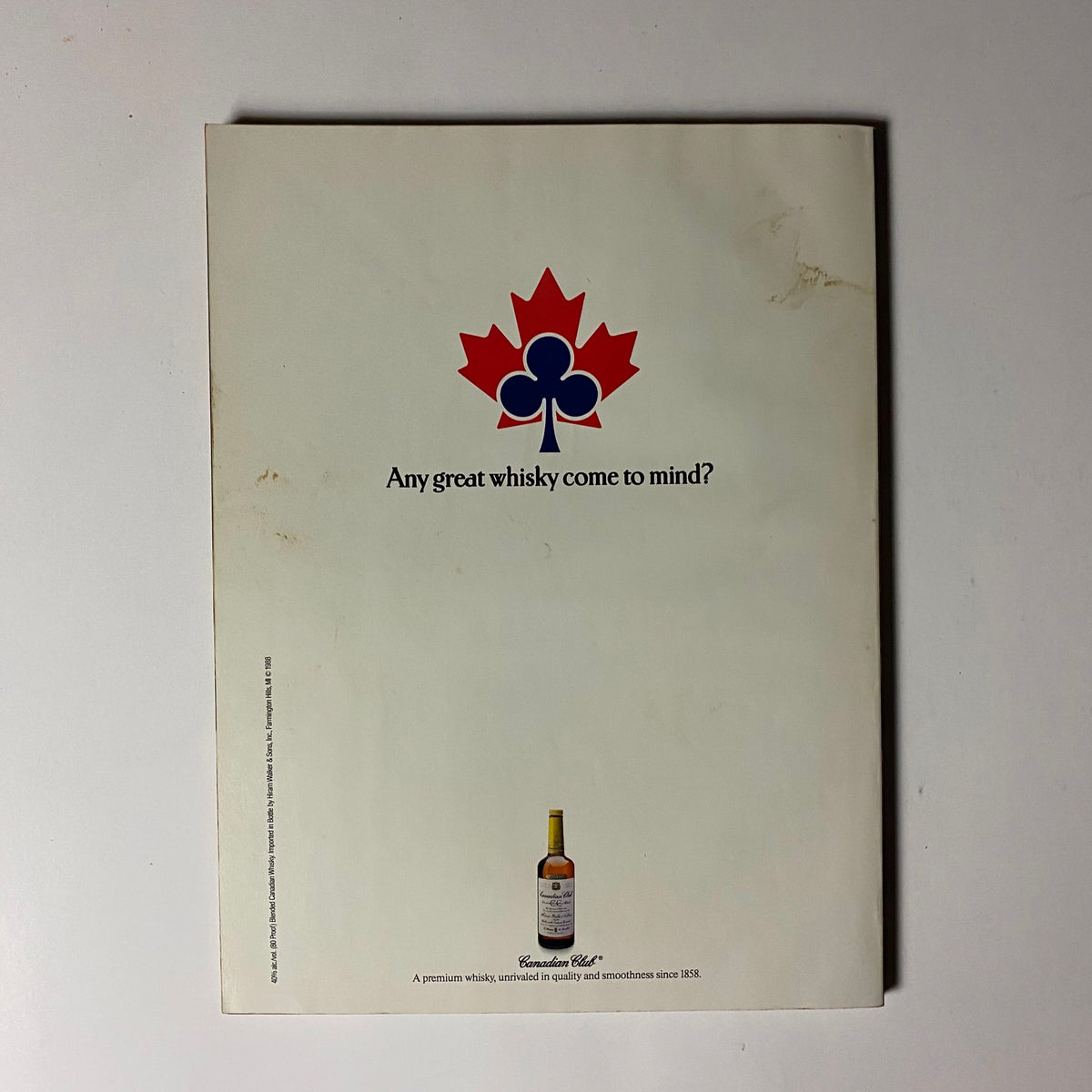 Back cover of Playboy Magazine March 1988 displaying a Canadian Club whisky advertisement with a minimalist design and brand logo.