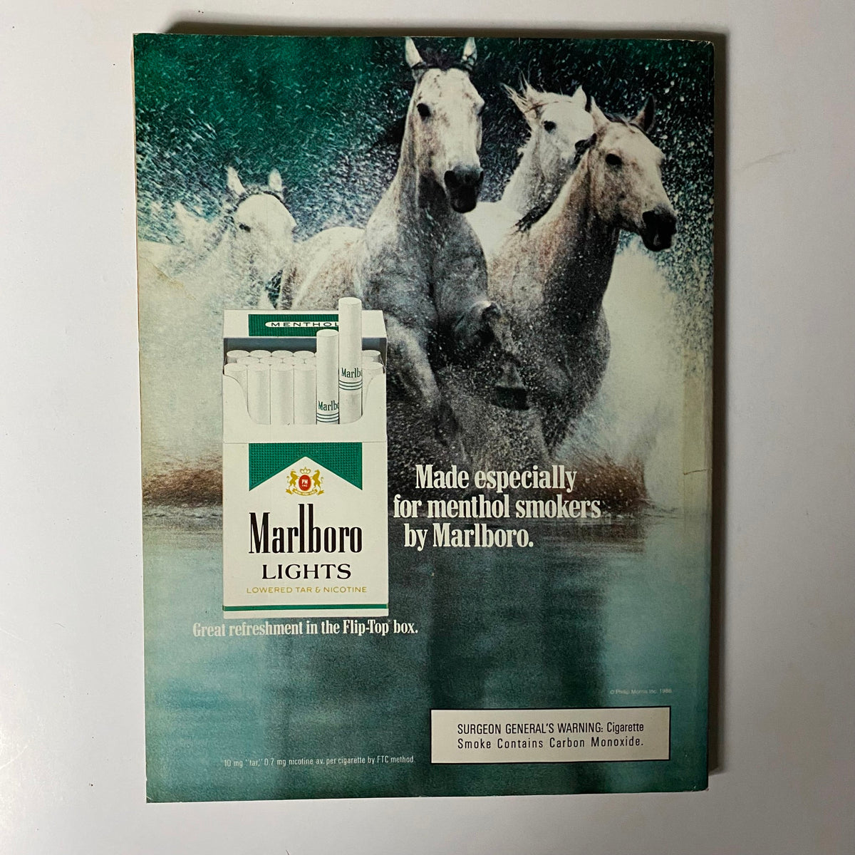 Vintage advertisement for Marlboro Lights cigarettes featuring horses splashing through water, highlighting the product's appeal to menthol smokers, from Playboy Magazine December 1988 Katariina Souri w Centerfold No Label.