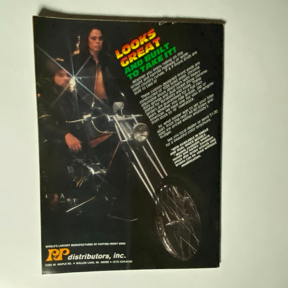 Back cover of the December 1982 VTG Biker Lifestyle Magazine, promoting motorcycle parts and accessories with an image of riders.