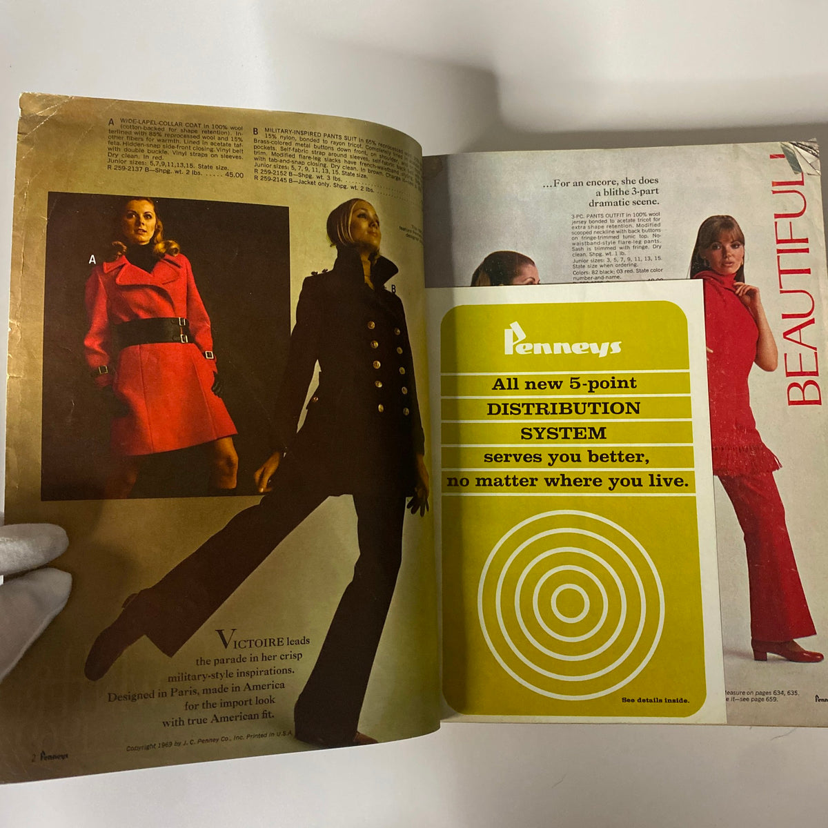 Interior page of the 1969 JC Penneys Fall and Winter Store Catalog showcasing vintage fashion styles including a stylish red coat and a military-inspired outfit.