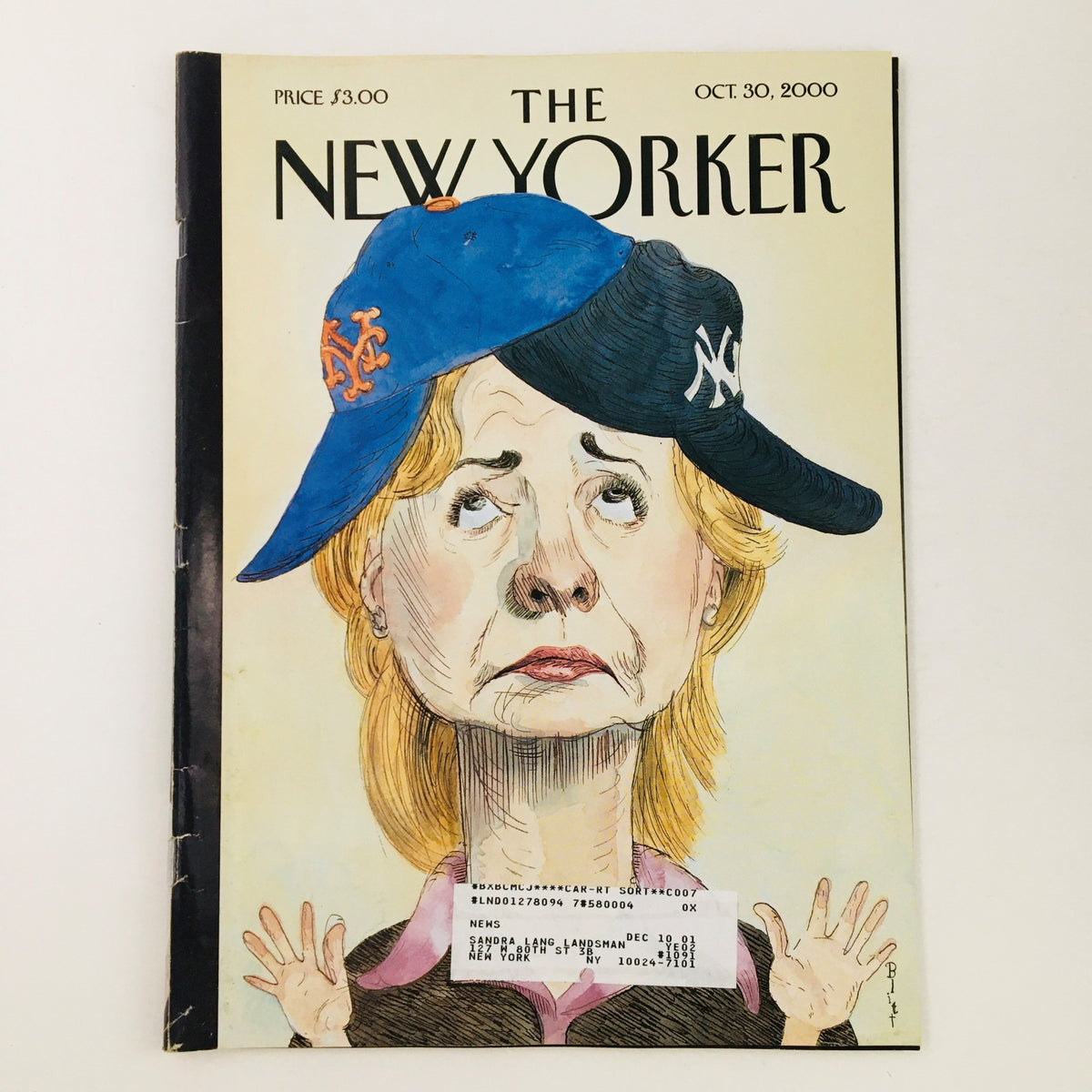 The New Yorker Magazine October 30 2000 cover featuring Hillary Clinton illustrated by Barry Blitt, showcasing Clinton wearing a New York Mets hat and a New York Yankees cap, with a cartoon style that highlights her expression.