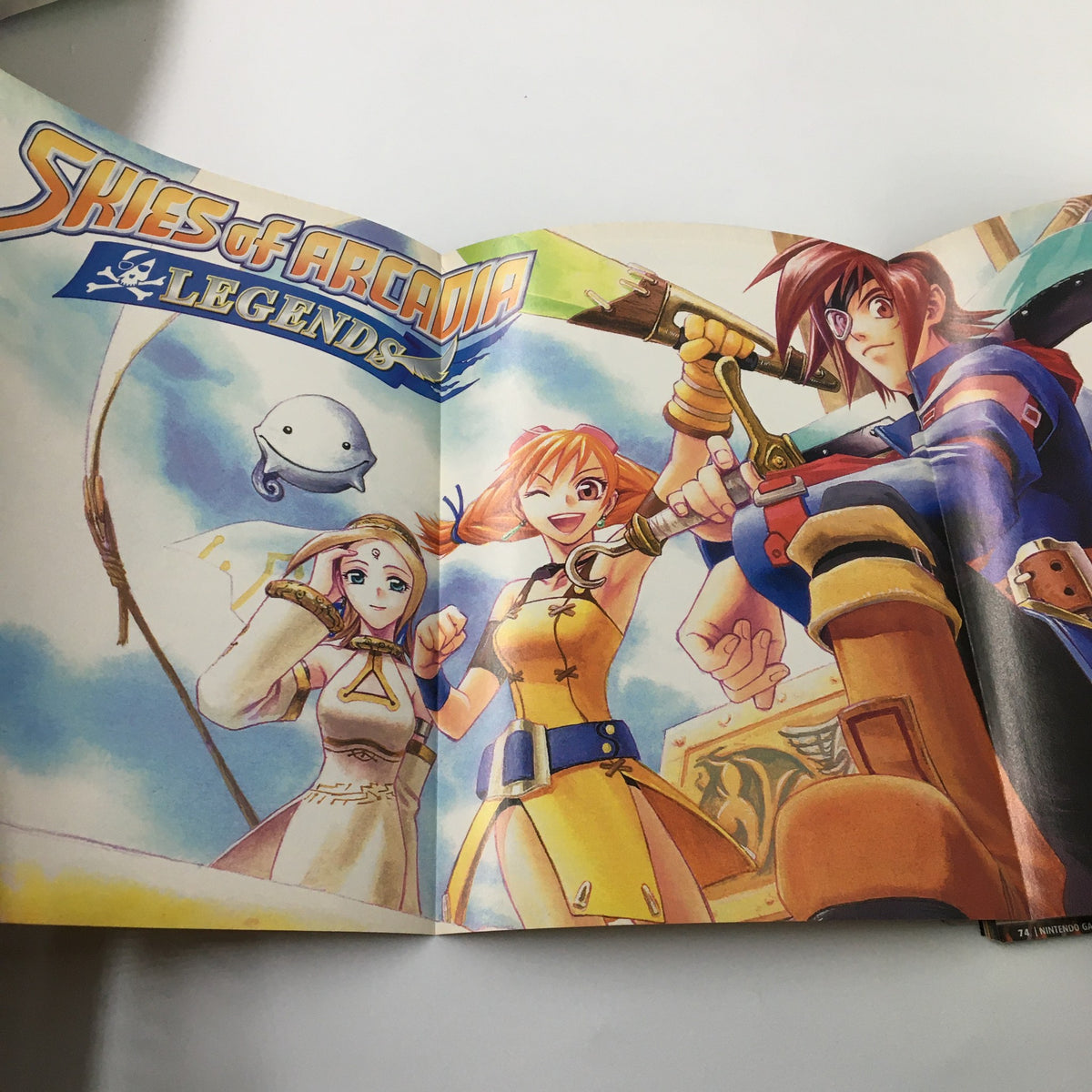 Illustration from Nintendo Power Magazine Vol. 164 January 2003 for Skies of Arcadia Legends, featuring main characters in vibrant artwork.
