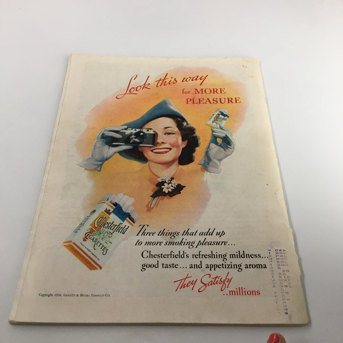 Back cover of VTG Time Magazine Vol. 31 No. 14 April 4 1938, featuring an advertisement for Chesterfield cigarettes, with a woman holding a camera.