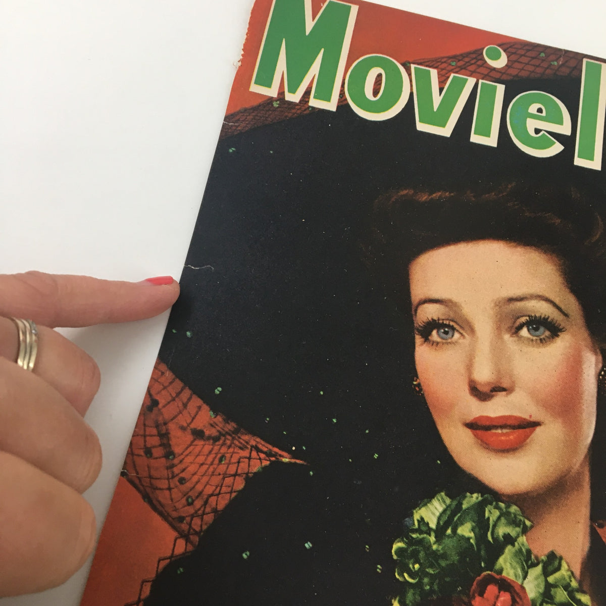 Close-up of the COVER ONLY Movieland Magazine February 1944 featuring Loretta Young, highlighting minor wear and a small rip, emphasizing its vintage charm.