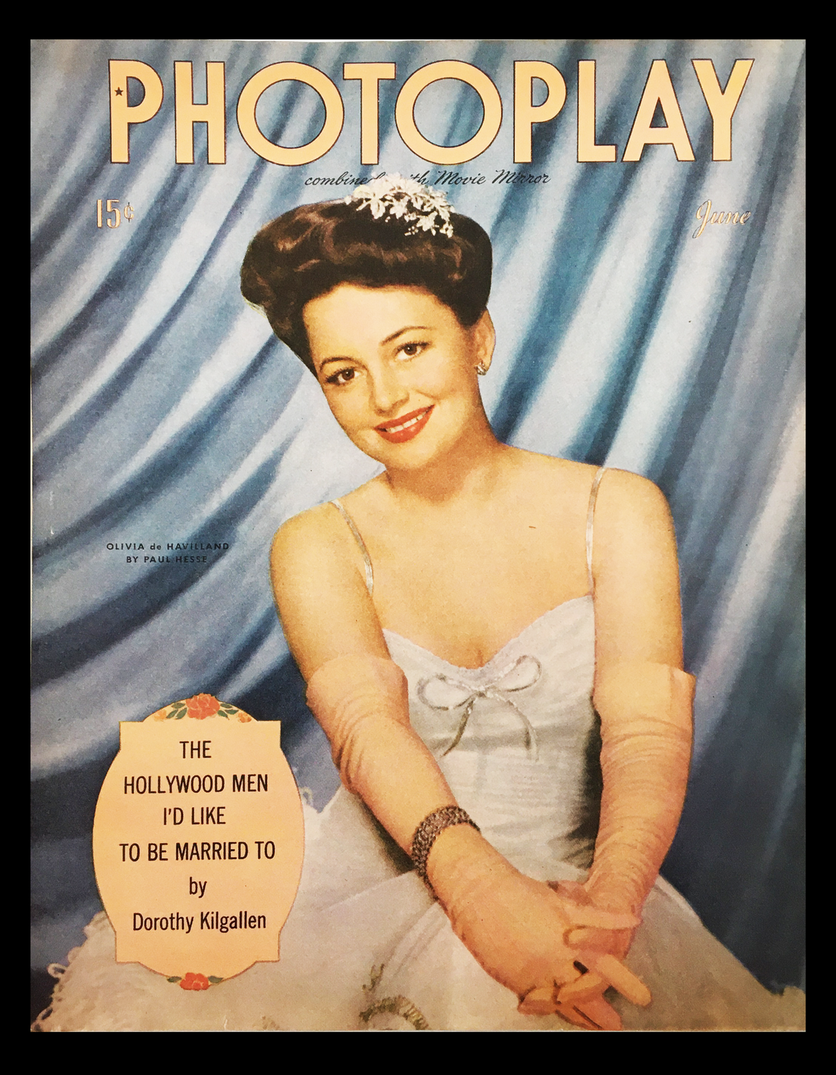 COVER ONLY Photoplay Magazine June 1944 featuring Olivia de Havilland, showcasing her elegance in a white dress with long pink gloves against a blue backdrop.