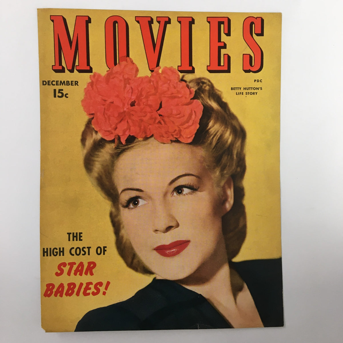 COVER ONLY Movies Magazine December 1943 showcasing Betty Hutton, highlighting the tagline 'THE HIGH COST OF STAR BABIES!' on a decorative cover.