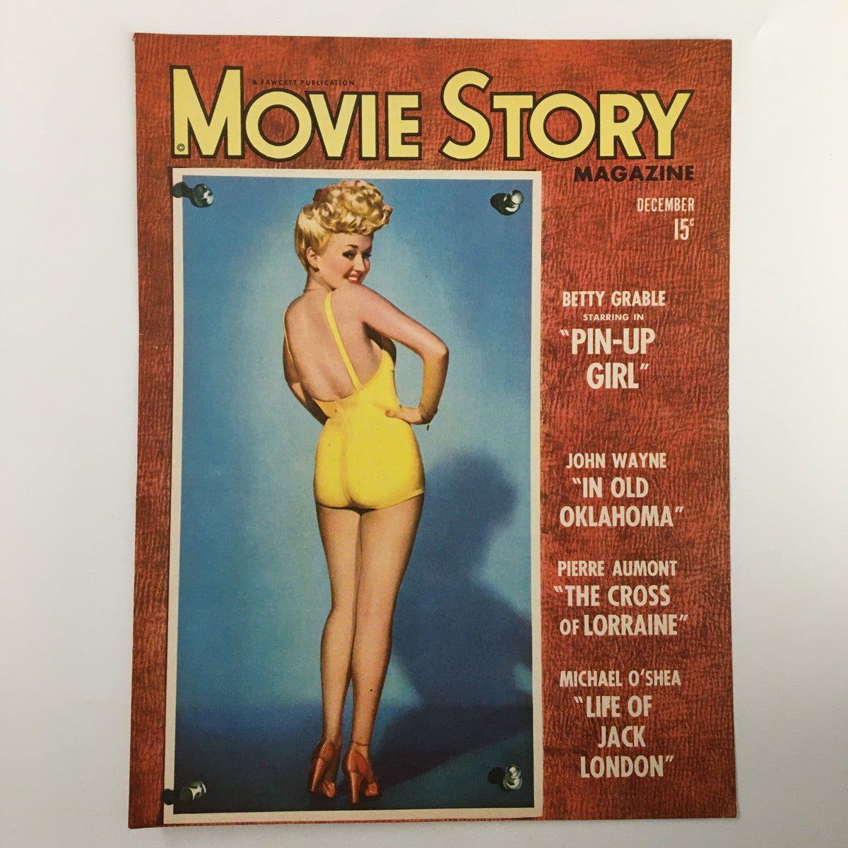 COVER ONLY Movie Story Magazine December 1943 with Betty Grable depicted as Pin-Up Girl, highlighting her iconic hairstyle and vintage charm in a yellow outfit.
