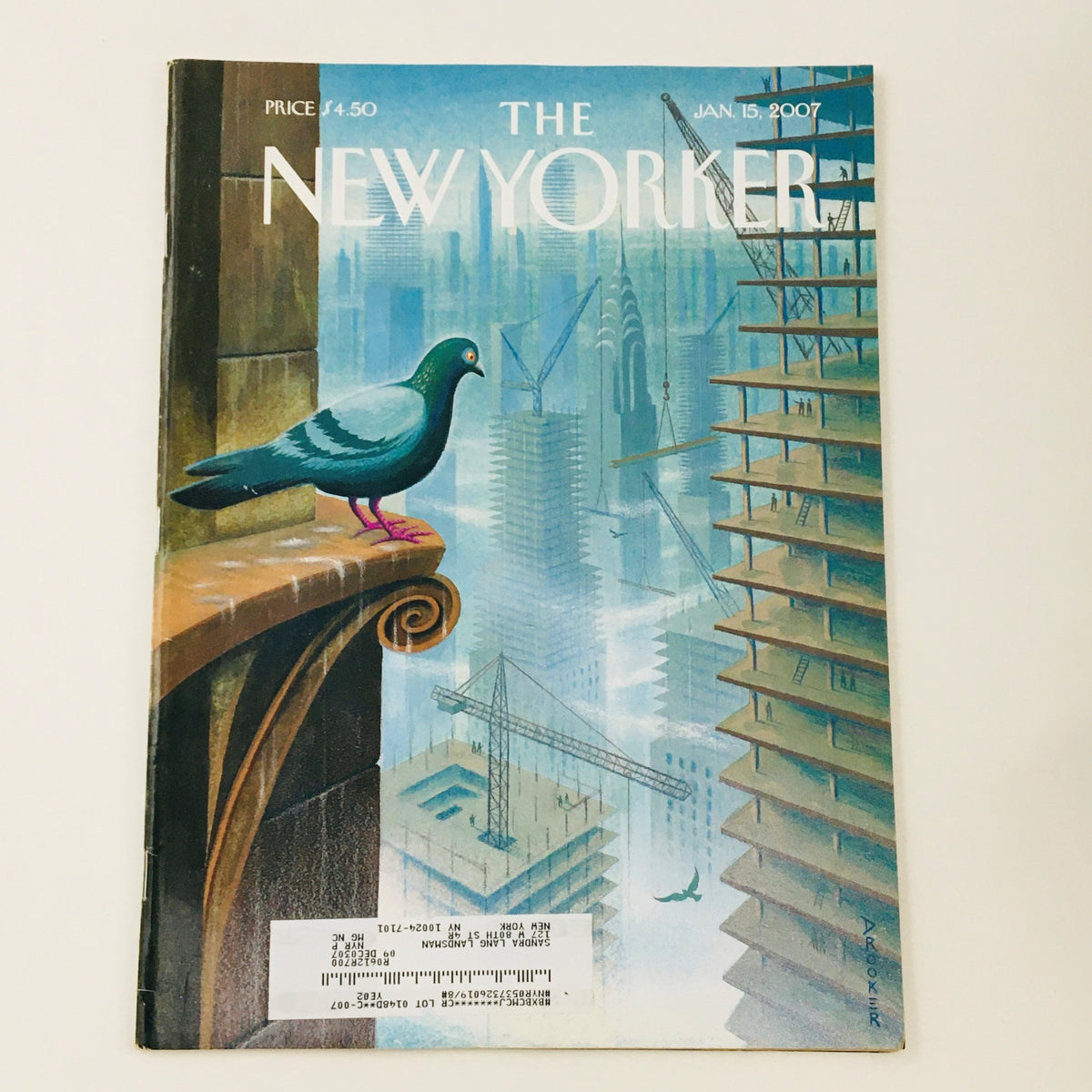 The New Yorker Full Magazine January 15 2007 featuring a striking cover illustration by Eric Drooker, depicting a pigeon on the edge of a skyscraper overlooking a city skyline with cranes and modern architecture.